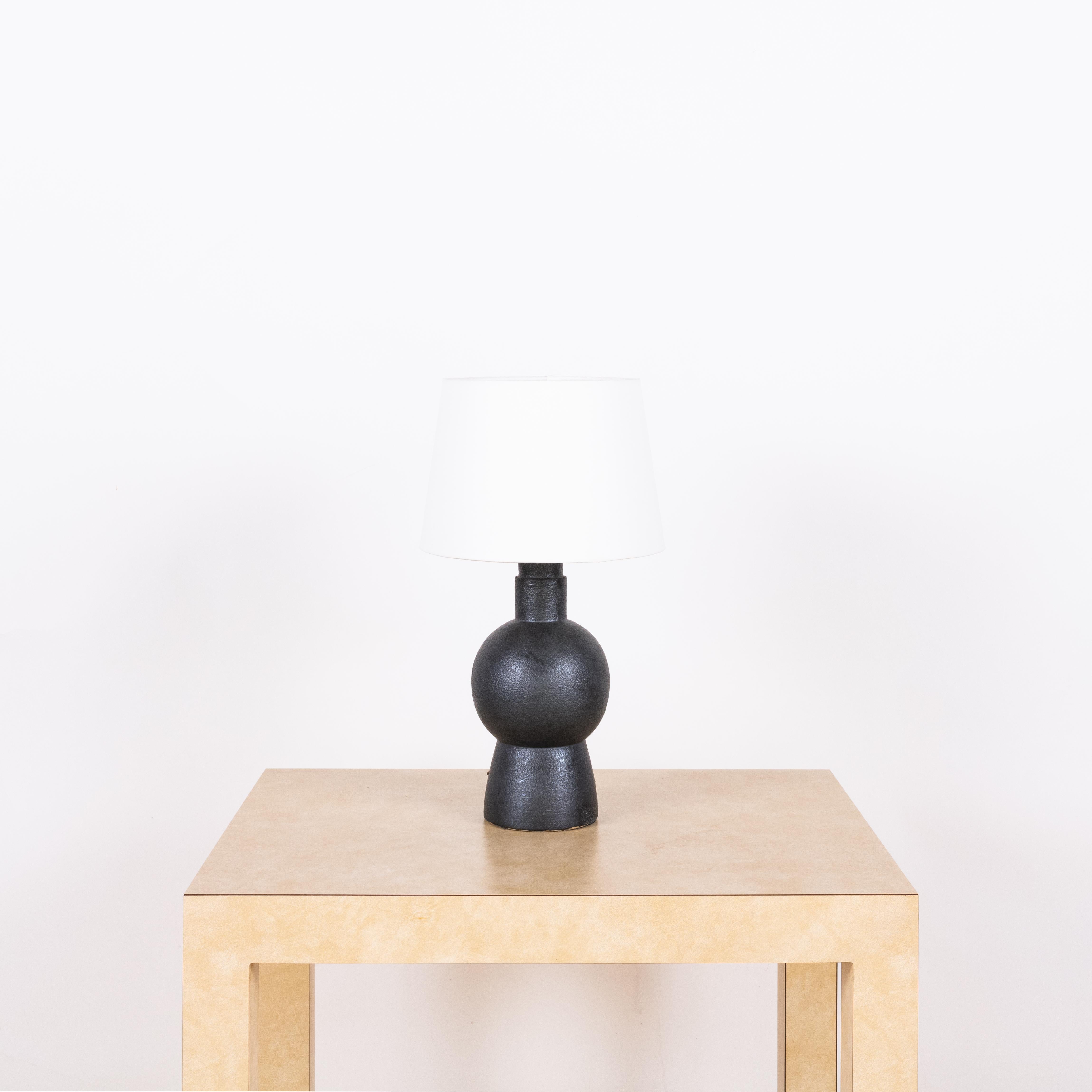 Black 'Bilboquet' stoneware lamp by Design Frères.

Dimensions listed (10 in. diameter x 18 in. tall) are the overall dimensions of the lamp plus the shade (as pictured). The lamp base is 11 in. tall and the shade is 7 in. tall.
