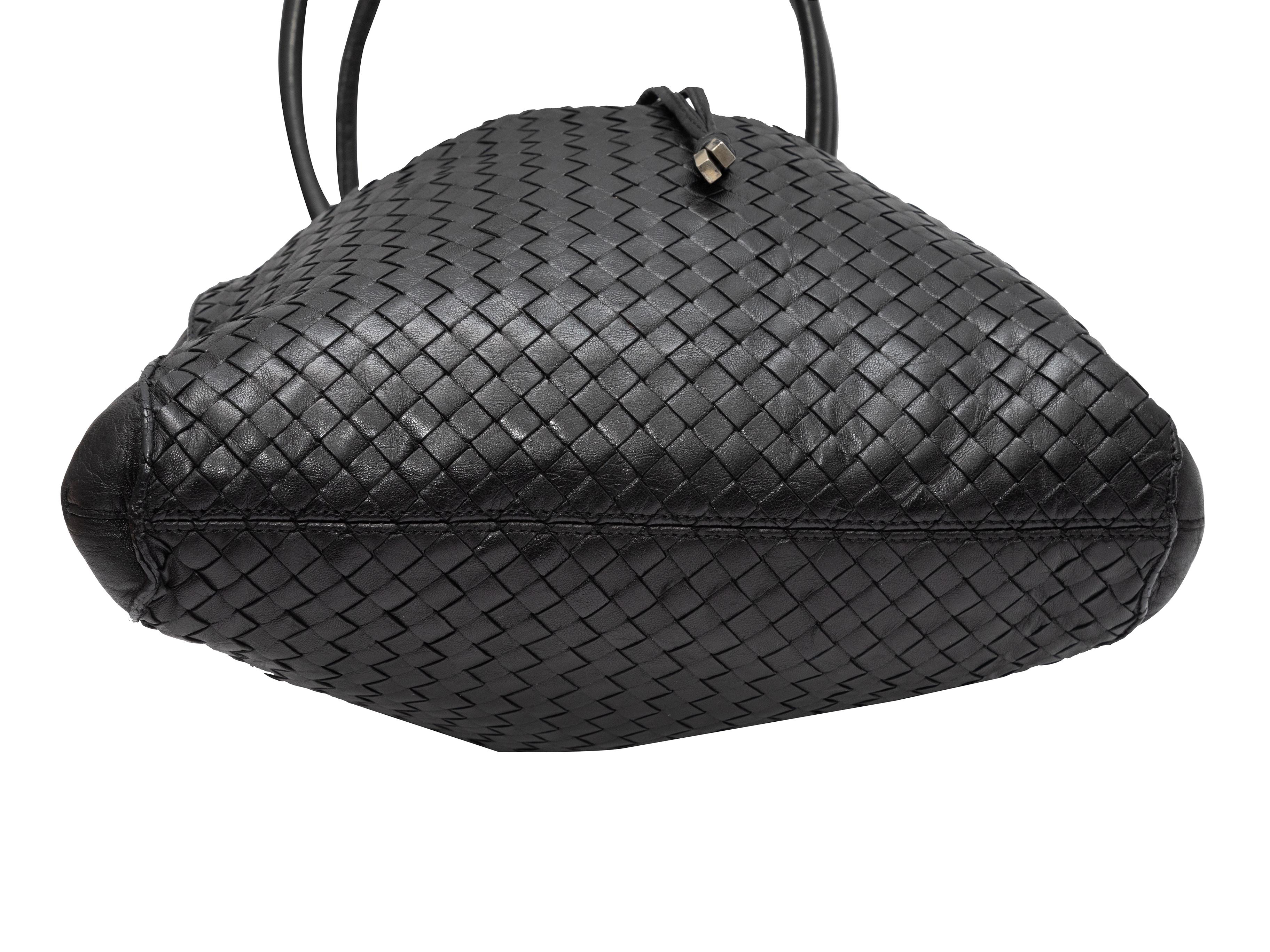 Product Details: Black Bottega Veneta Intrecciato Shoulder Bag. This bag features a woven leather body, gold-tone hardware, dual rolled shoulder straps, and a top drawstring closure. 11.5