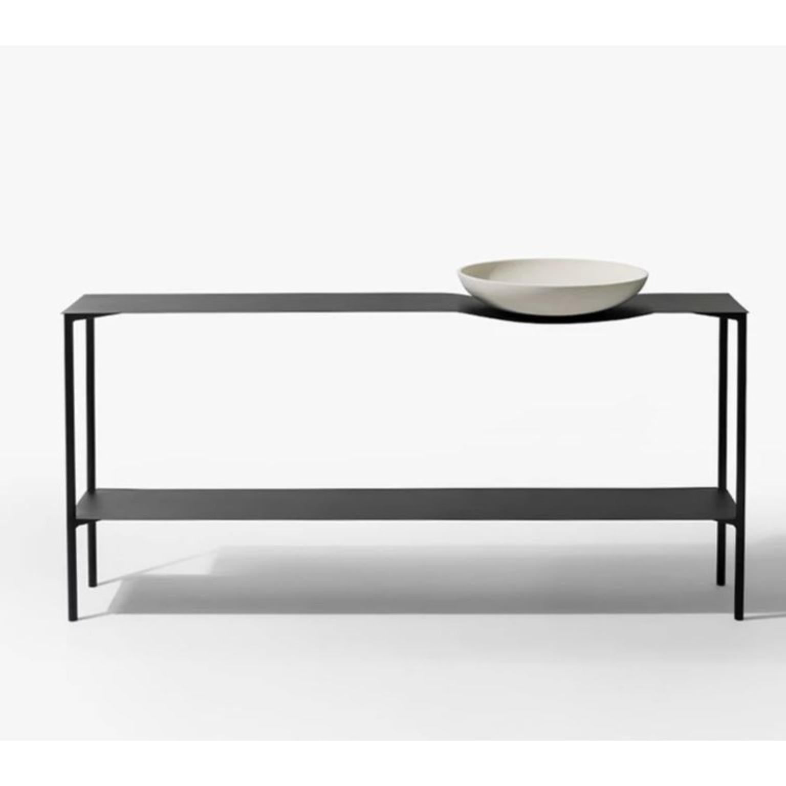 Black Bowl Console Table by Wentz
Dimensions: D 45 x W 165 x H 80 cm
Materials: Steel, Ceramic, Stainless Steel.
Coffee table with steel structure and top with textured electrostatic painting. Ceramic “Bowl” fixed to the top with a machined