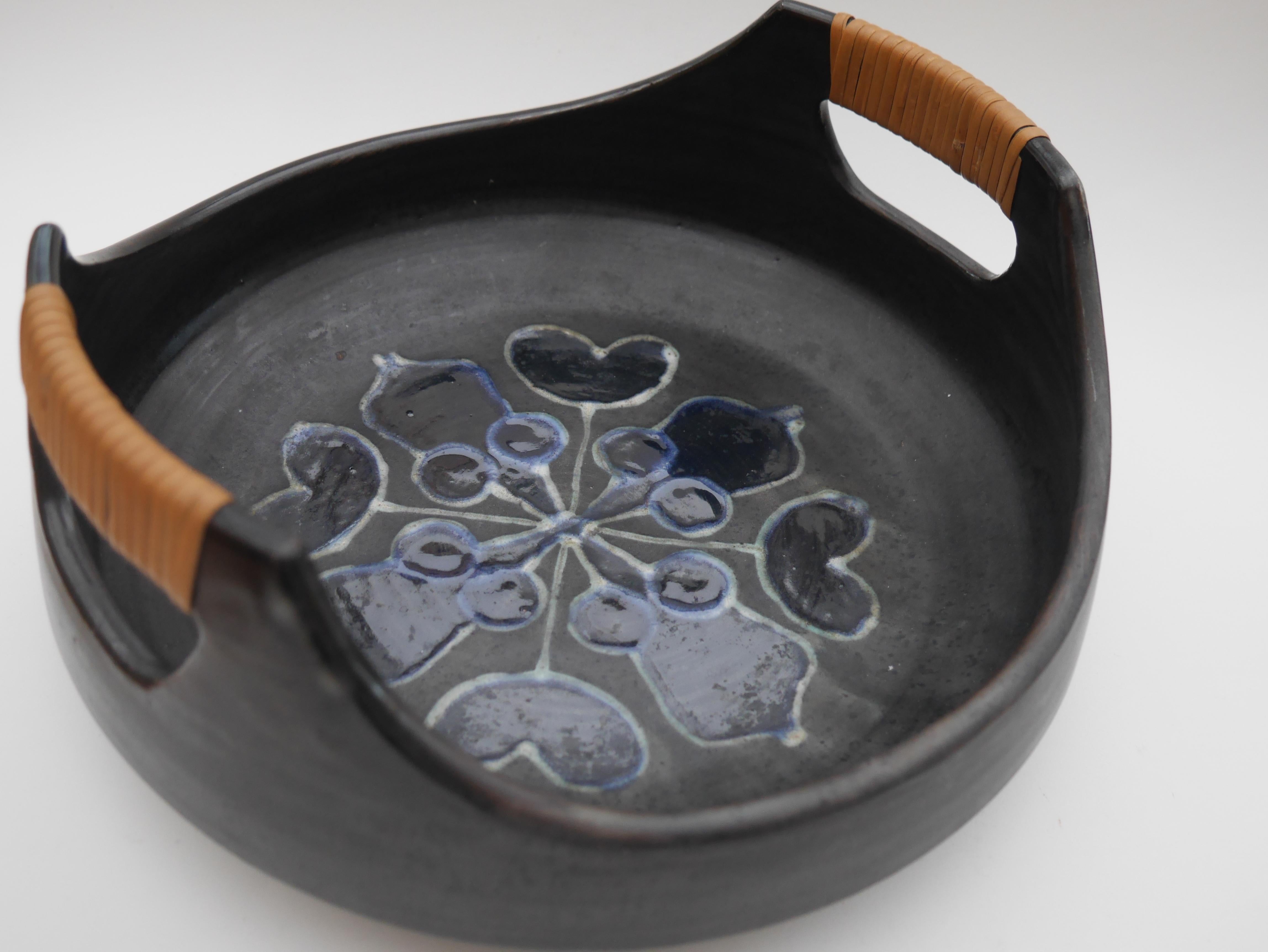 A stunning large, black bowl with handles, made by Thomas Hellström for Nittsjö, Sweden, marked 