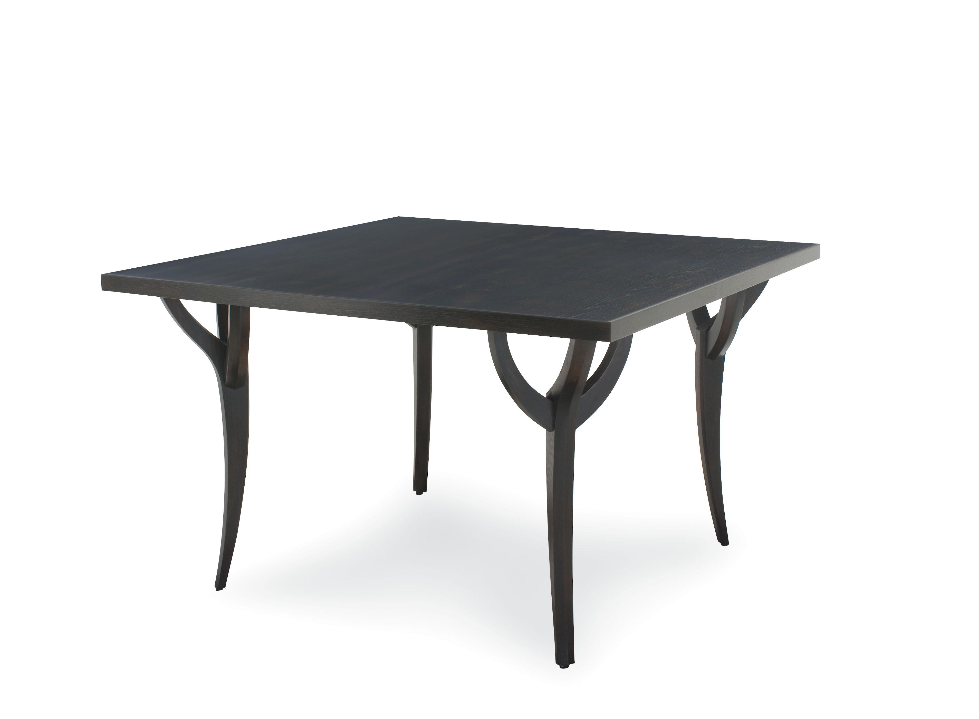 This pair of black branch dining tables are designed by Juan Montoya. The beautiful piece is made of ash solids and veneer. The table is composed of black wood tabletop that is supported by some branch like wooden legs. The dining table was part of