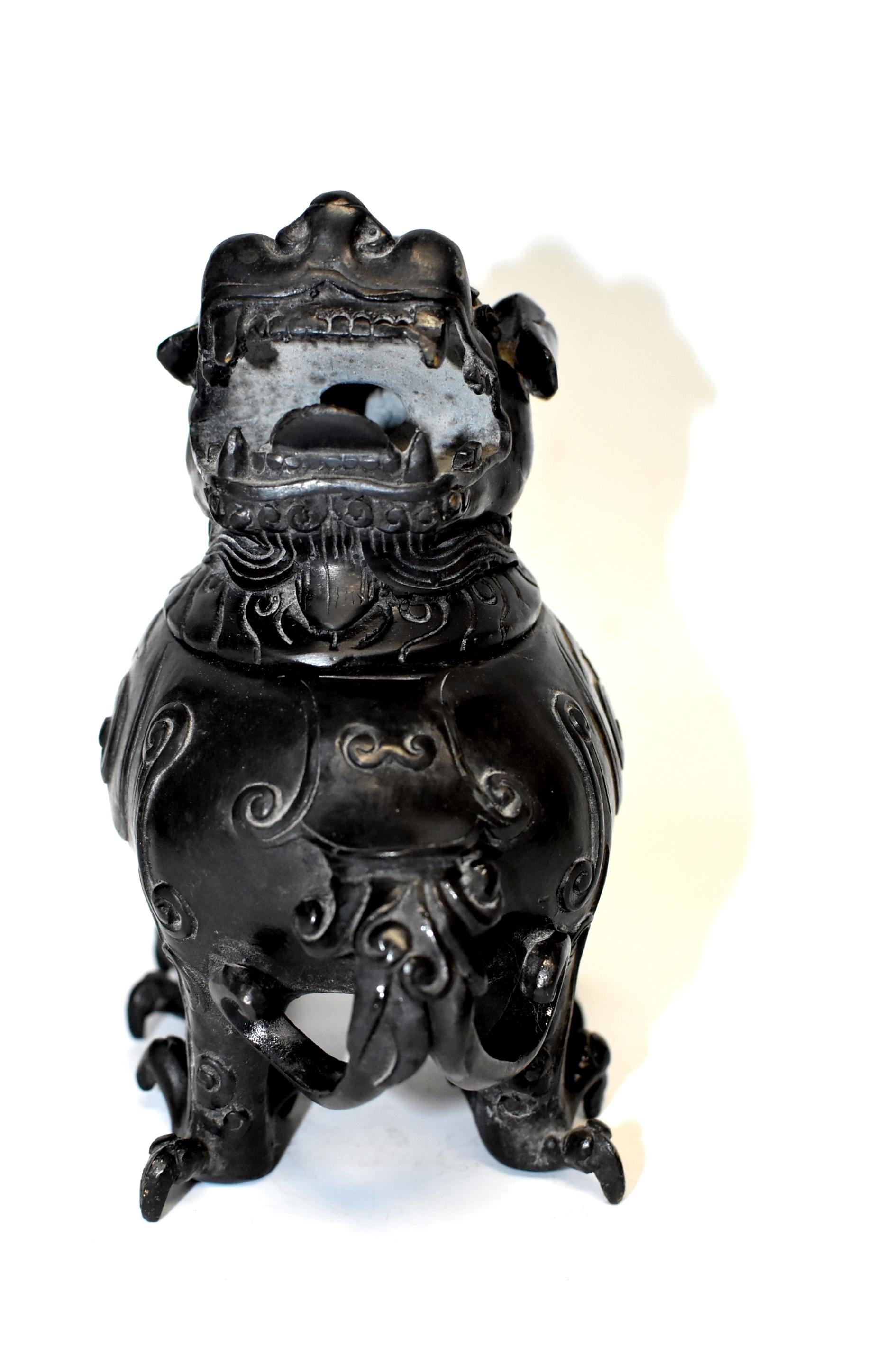 An unique beast form incense burner in an ancient design. The beast's head makes the lid while its 4 legs and paws stabilize the pot. Romantic, exotic scrolls decorate the body. Open mouth allows the perfumed air to escape. Refined craftsmanship.