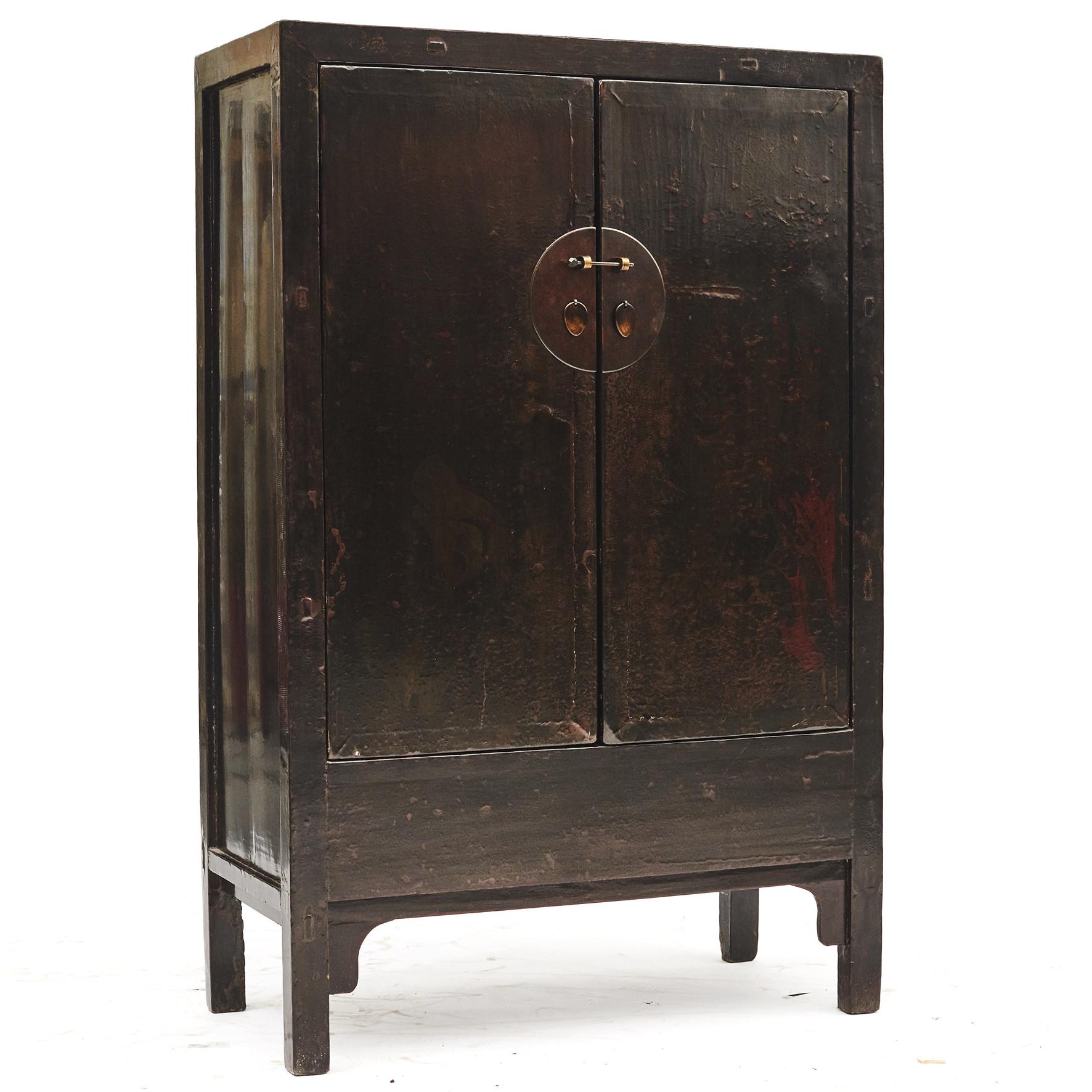 A Chinese Qing dynasty period cabinet.
Original thick black lacquer with red paint remnants from previous decorations. Lovely aged patina highlighted by a clear lacquer finish.
From Shanxi Province, China, 1800-1820.