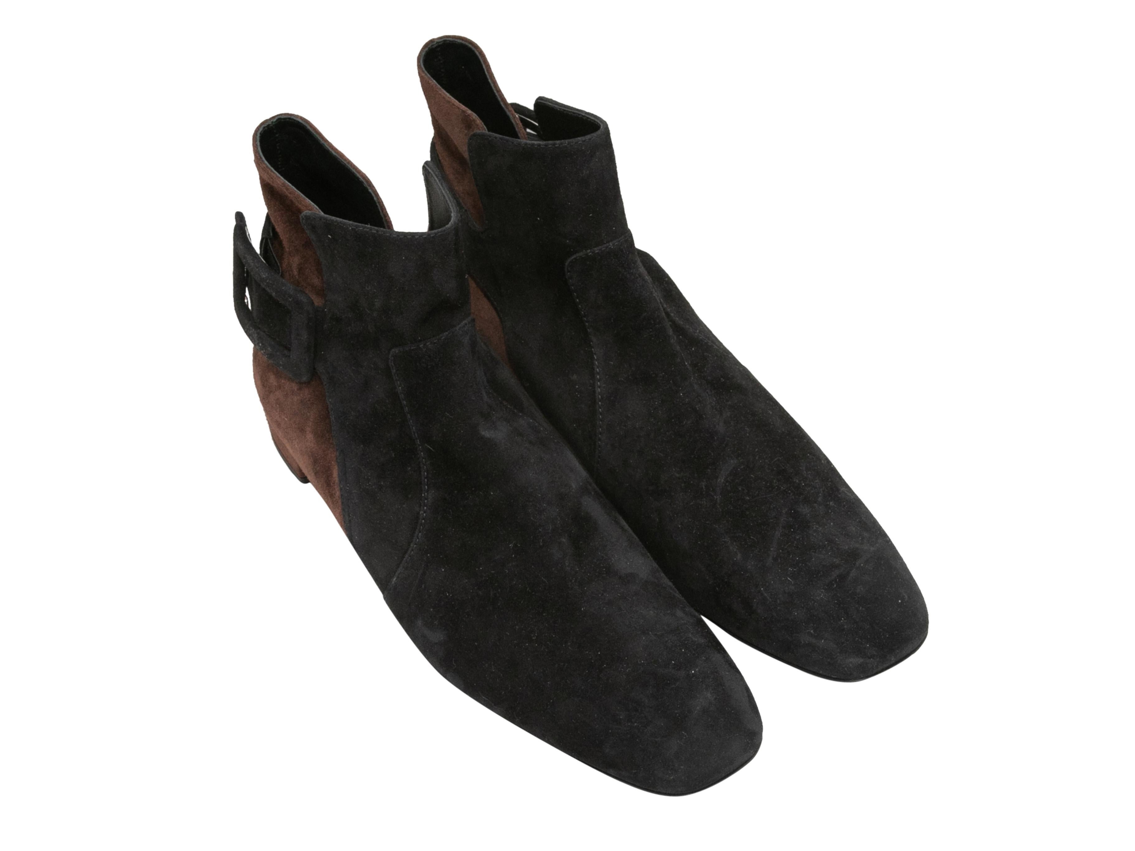 Black and brown color block suede ankle boots by Roger Vivier. Square toes. Buckle accents at sides. Low block heels. 4.75
