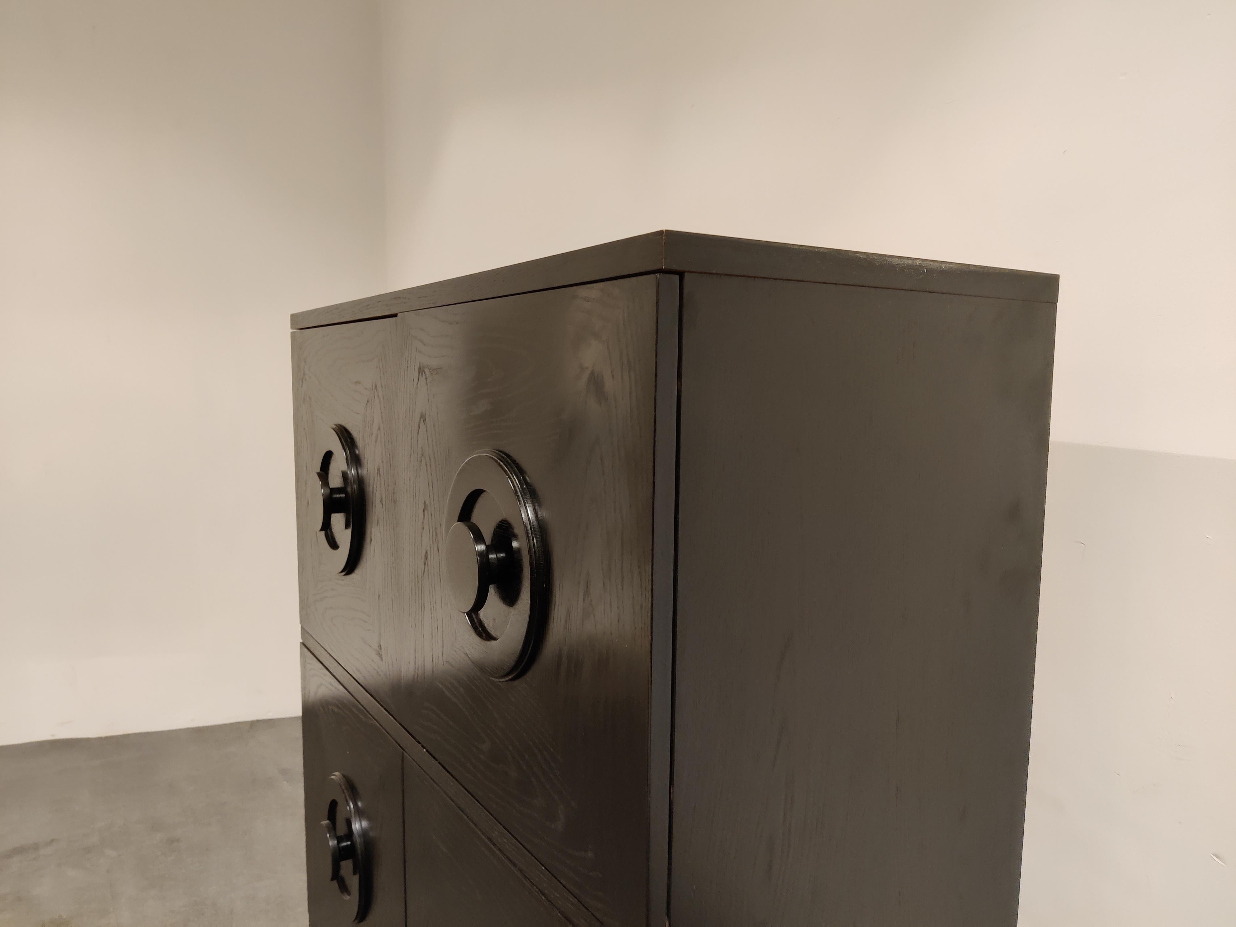 Beautiful black wenge wooden brutalist bar cabinet.

The cabinet consists of four doors and offers plenty of storage space.

Good condition.

1970s - Belgium
Dimensions:
Height: 121cm/47.63