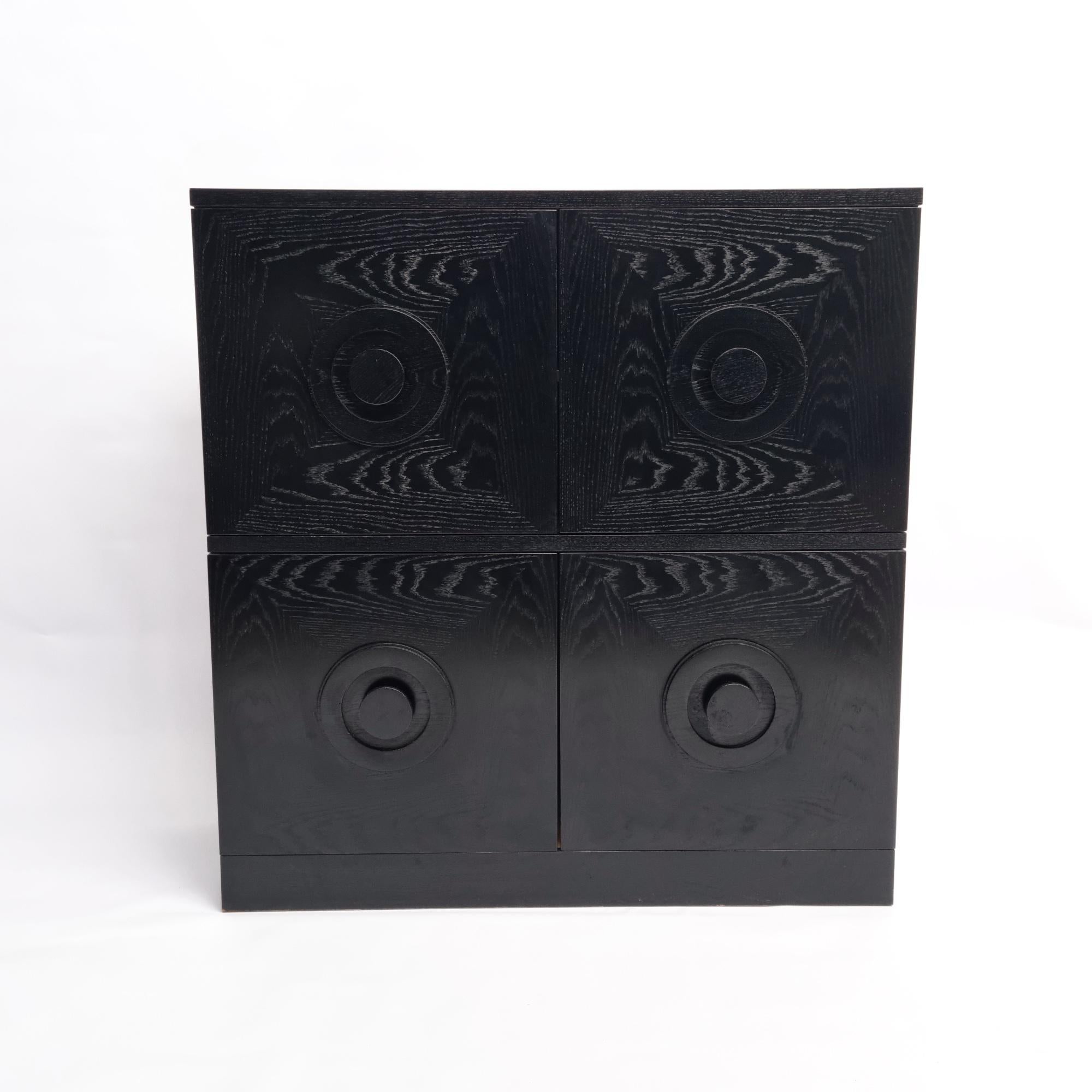 Black Brutalist cabinet in black lacquered oak, Belgium 1970s. This sideboard features four graphic patterned doors. It provides plenty of storage which makes it both very functional and decorative. These cabinets are often attributed to Belgian