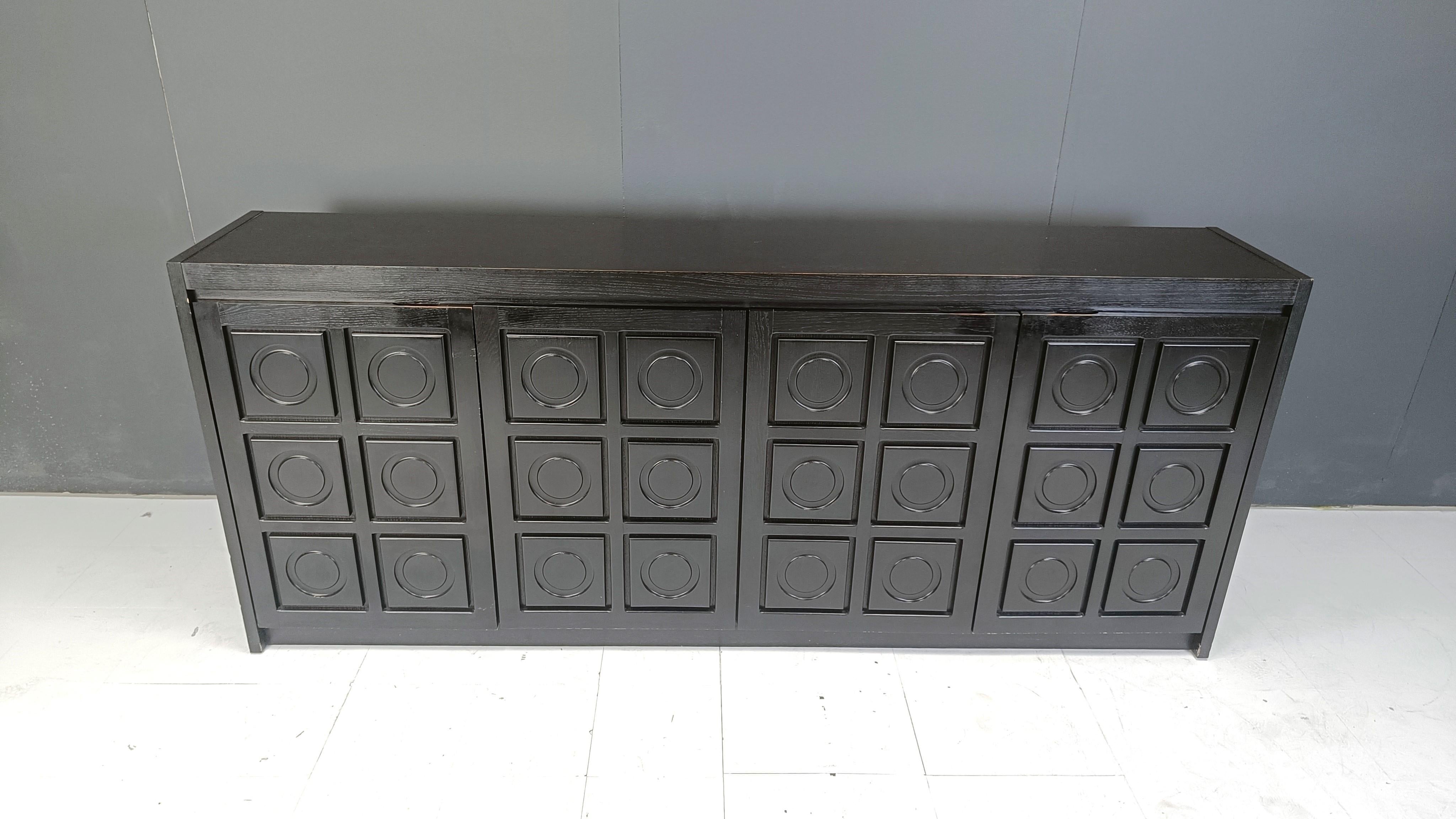 Ebonized black brutalist credenza with 4 graphical doors 

Beautiful timeless design

Good condition with normal age related wear

1970s - Belgium

Dimensions:

Height: 100cm
Width: 250cm
Depth: 46cm

Ref.: 25040303

*All images are always part of
