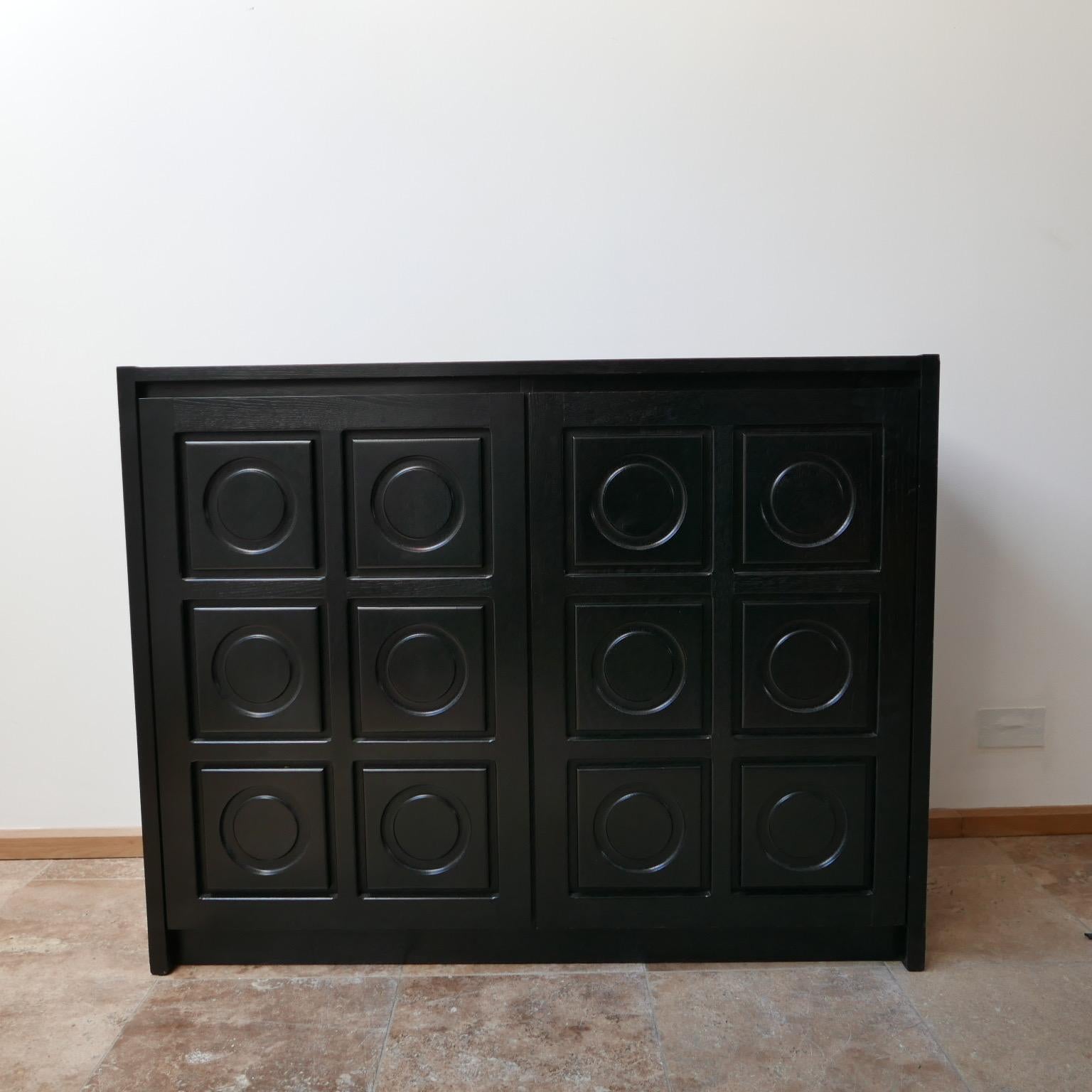 A Brutalist mid-sized sideboard or credenza in the manner of De Coene. 

Belgium, circa 1970s. 

Two doors reveal shelving and drawers internally. 

Dimensions: 128.5 W x 46 D x 100 H in cm. 

 