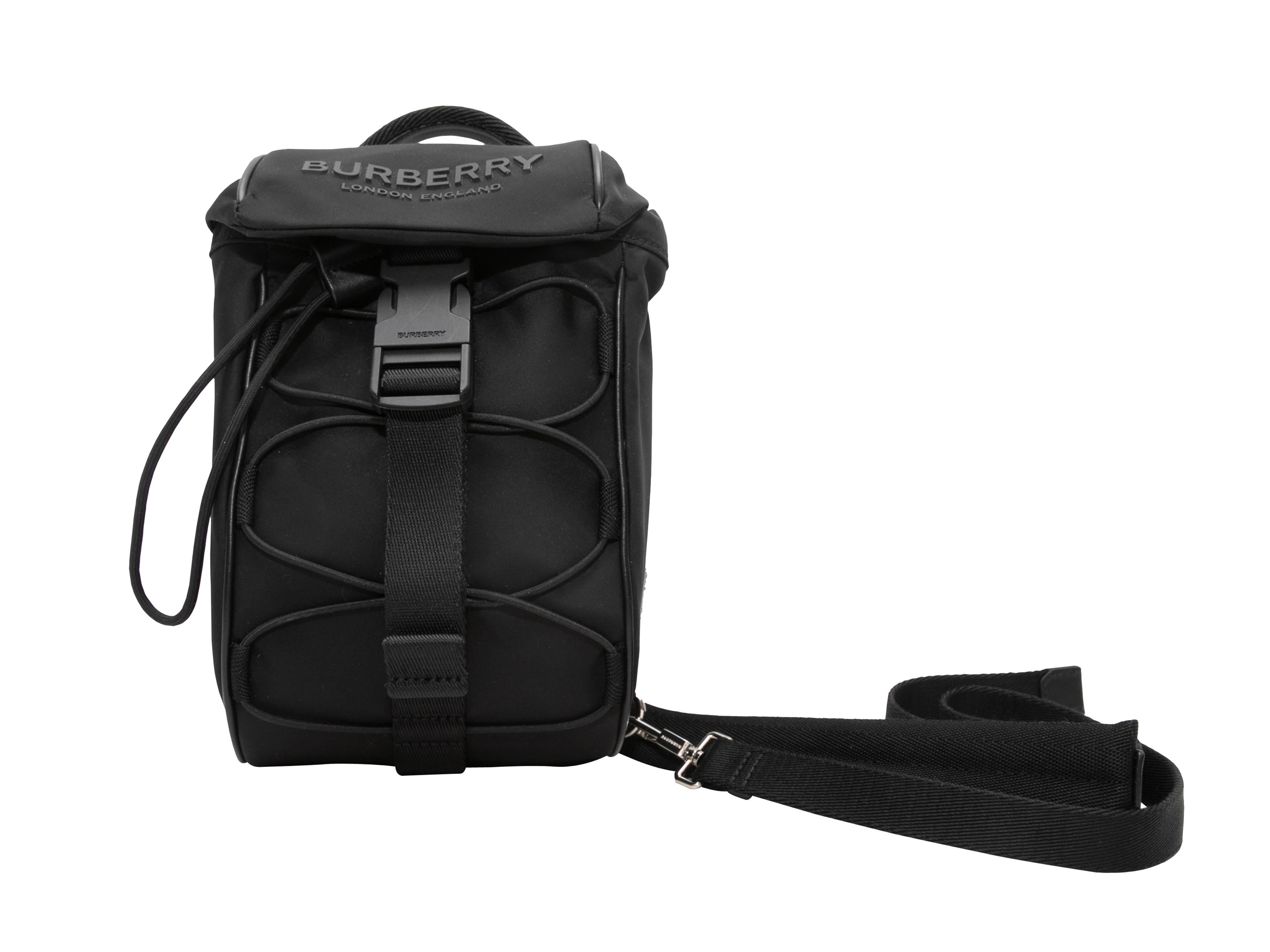 Black Burberry Murray Nylon Sling Bag. The Murray Sling Bag features a nylon body, silver-tone metal and plastic hardware, a single adjustable shoulder strap, and front drawstring and buckle closures. 6.5