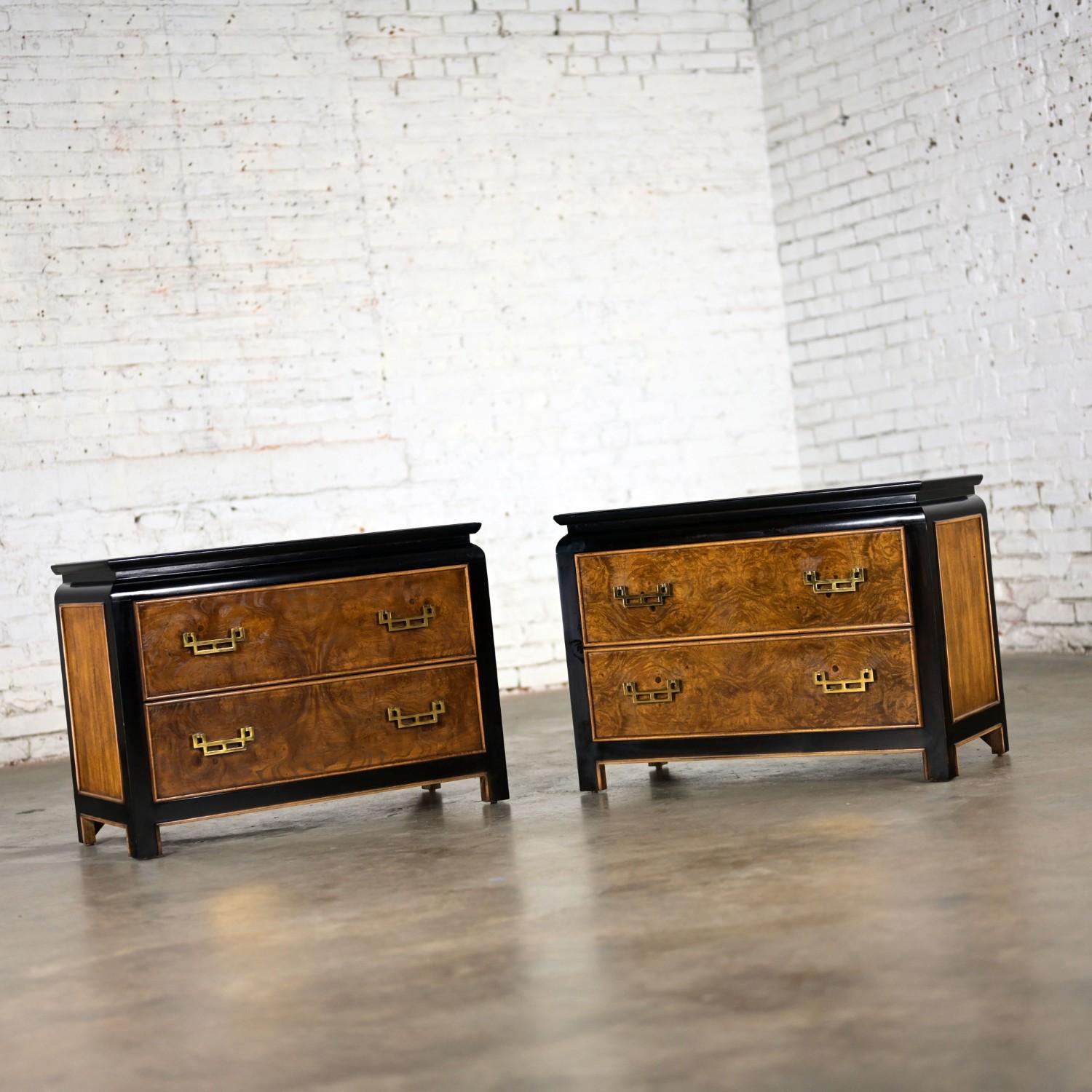 Magnificent vintage Chinoiserie Chin Hua Collection pair of nightstands or end tables by Raymond K. Sabota for Century Furniture comprised of an ebony-tone wood frame, burlwood inlays, brass trim & hardware, double doors, and two drawers each.