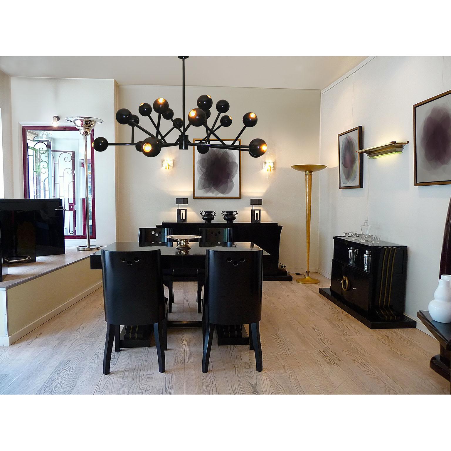 An amazing extra large chandelier in high glossy black lacquer finished metal, in the style of Philippe Starck. Six star disposed arms, featuring three illuminated spheres each, 18 x E14 sockets (or E12 adapters for the US). 
Dimensions:
Diameter