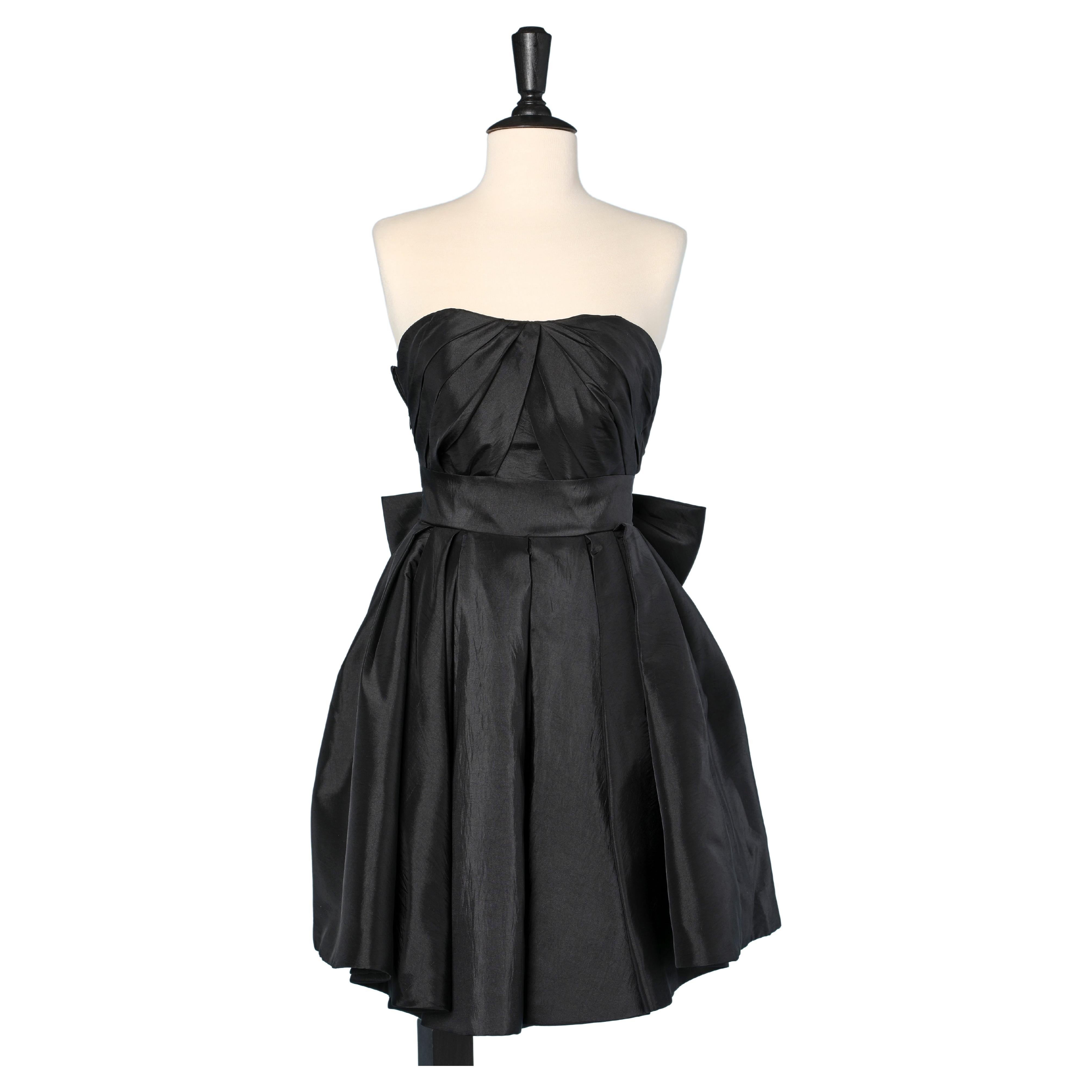 Black bustier cocktail dress in faille with bow in the back Circa 1980 For Sale