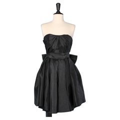 Black bustier cocktail dress in faille with bow in the back Circa 1980
