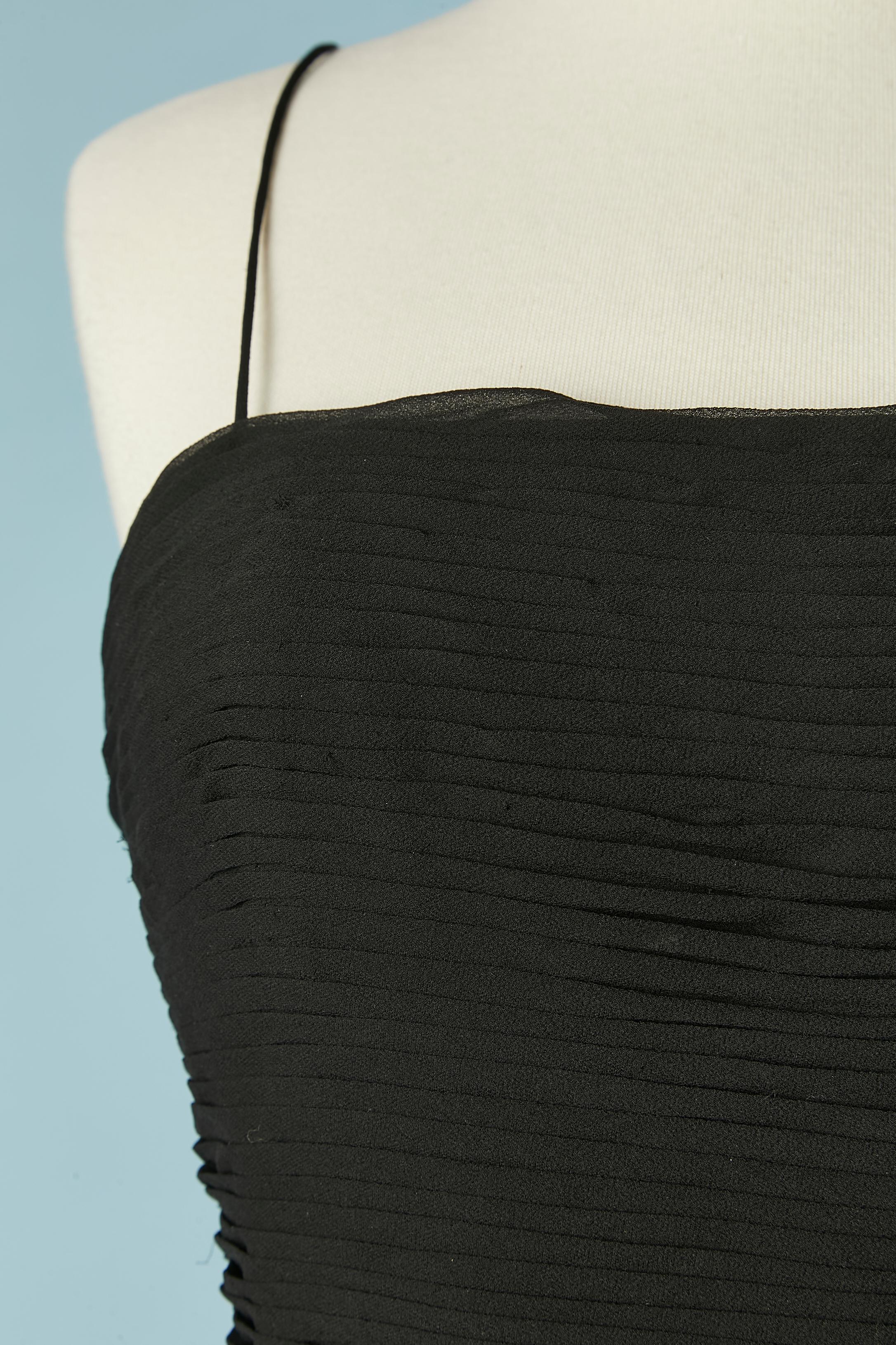 Black bustier cocktail dress with beads and feathers embellishment . No fabric composition tag but the main fabric is probably silk chiffon and the lining probably acetate. Boned bustier inside the dress with zip and hook&eye closure in the middle