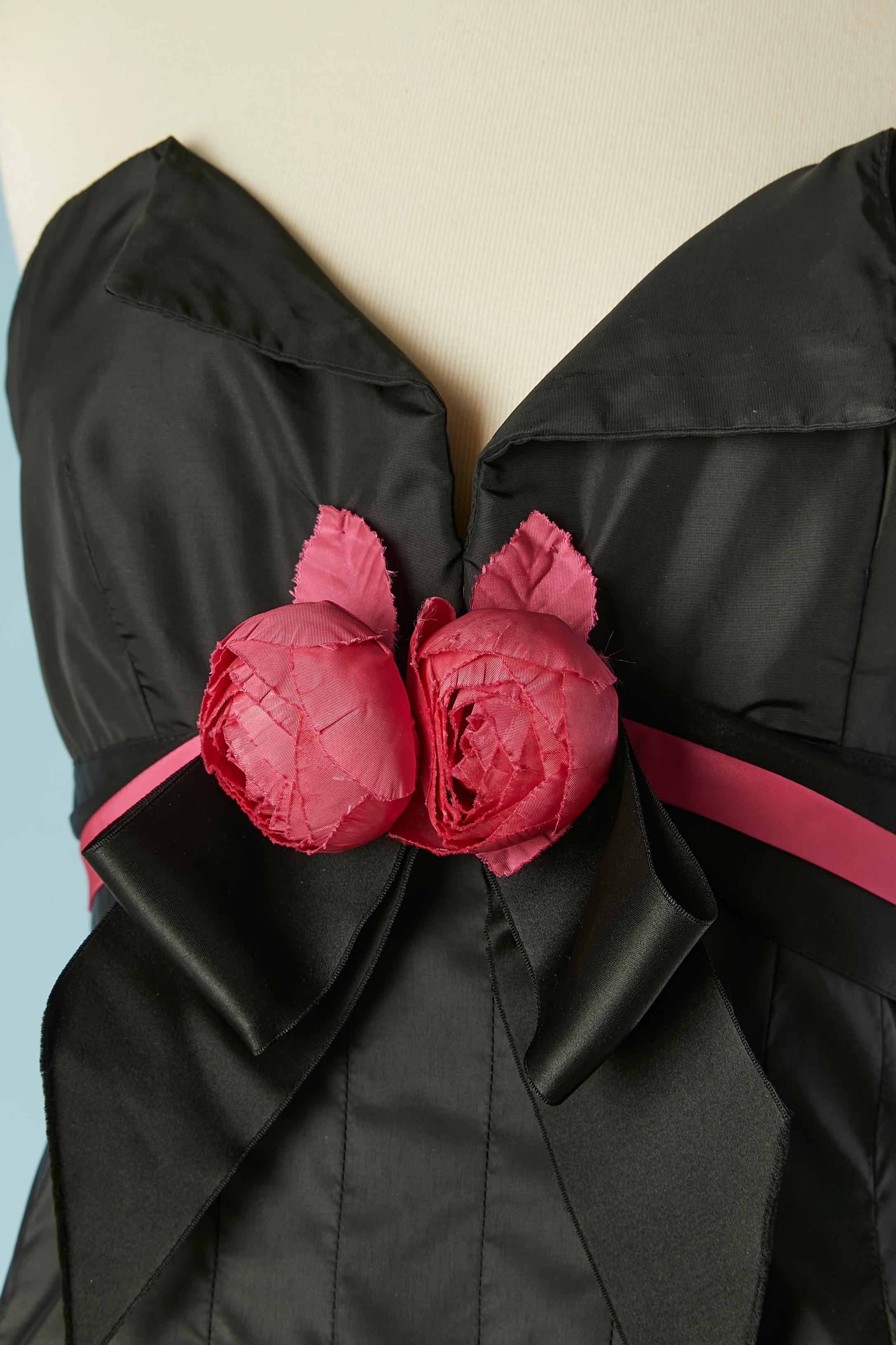 Black bustier cocktail dress with fabric roses embellishment  and black satin bow. Main fabric composition: 52% nylon, 48% polyester (looks like taffetas) 
Black tulle petticoat with ruffles edge. 
Boned bustier. Zip and hook&eye closure on the