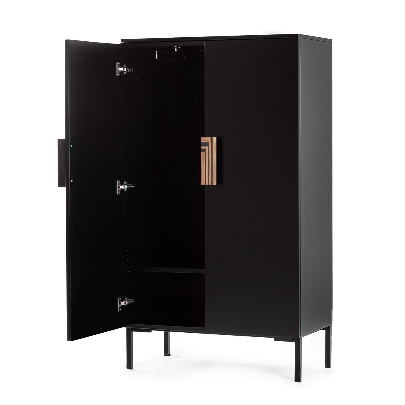 A splendid and elegant design that will imbue a refined contemporary interior with utmost sophistication, this cabinet will elevate the style of an entryway decor. Superbly handcrafted of black-lacquered wood, it features bright gold-finished