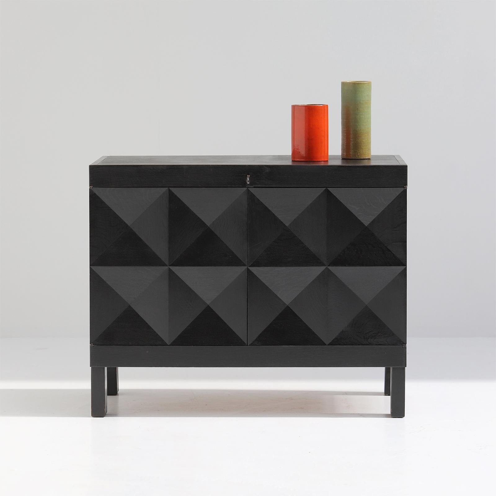 Beautiful and quality crafted cabinet with op-art doors designed by J. Batenburg for MI, Belgium 1969. These quality Belgian made furniture were definitely built during the late 60s and early 70s. Some dealers do sell this as a product from De