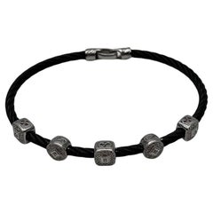 Bracelet en acier filigrane avec rangée de câbles noirs et diamants en or blanc 18 carats