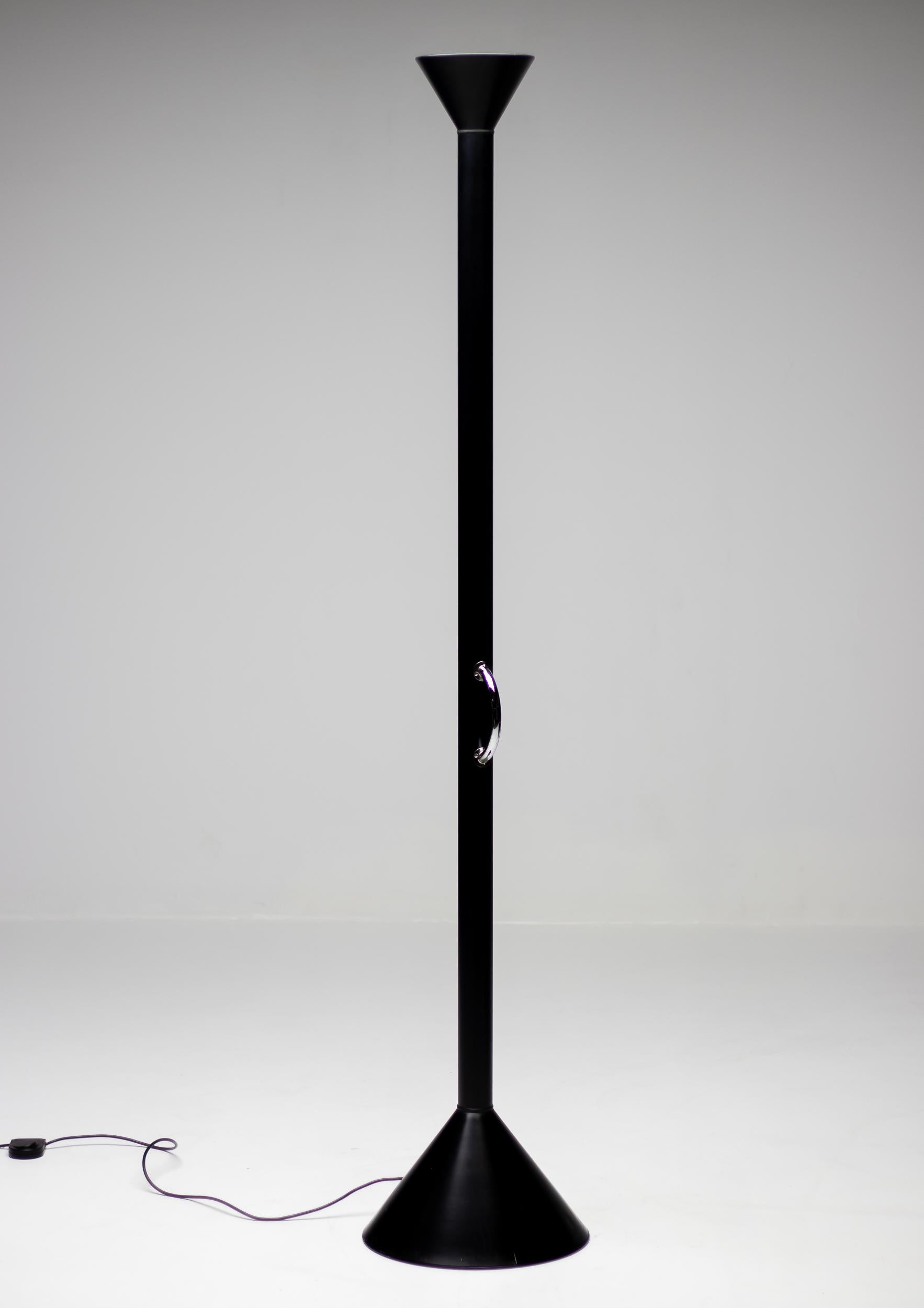 Limited Edition Callimaco floor lamp by Ettore Sottsass in black.
Callimaco was designed by Ettore Sottsass for Artemide in 1982 and became a true icon of 1980s.
The lamp lacks all unnecessary parts and strips down to pure functionality. This very