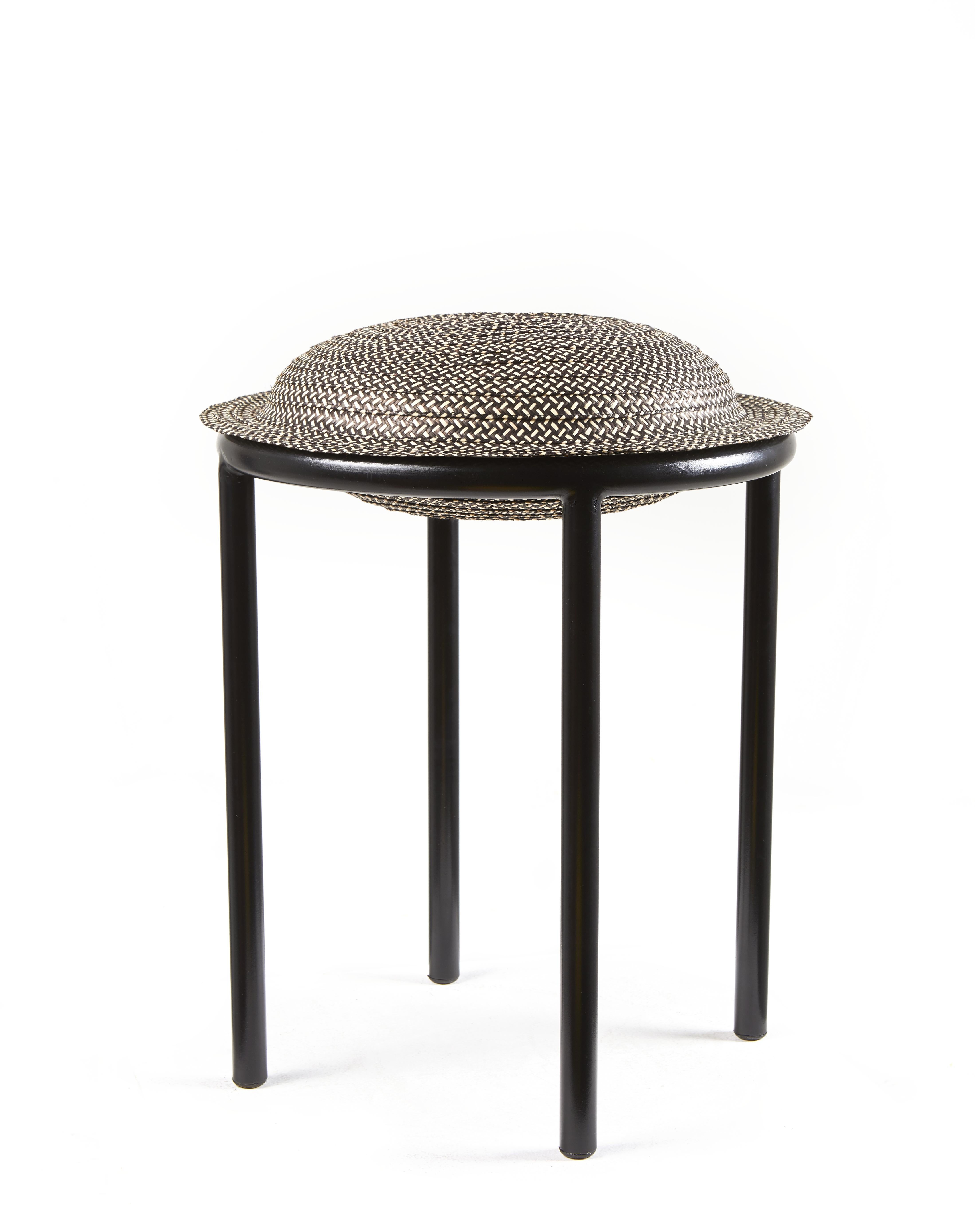 Black cana stool by Pauline Deltour by Cristina Celestino
Materials: galvanized and powder-coated tubular steel. Caña Flecha.
Technique: hand-woven with natural fibers in Colombia. Natural dyed. 
Dimensions: diameter 40.2 x height 48.1 cm