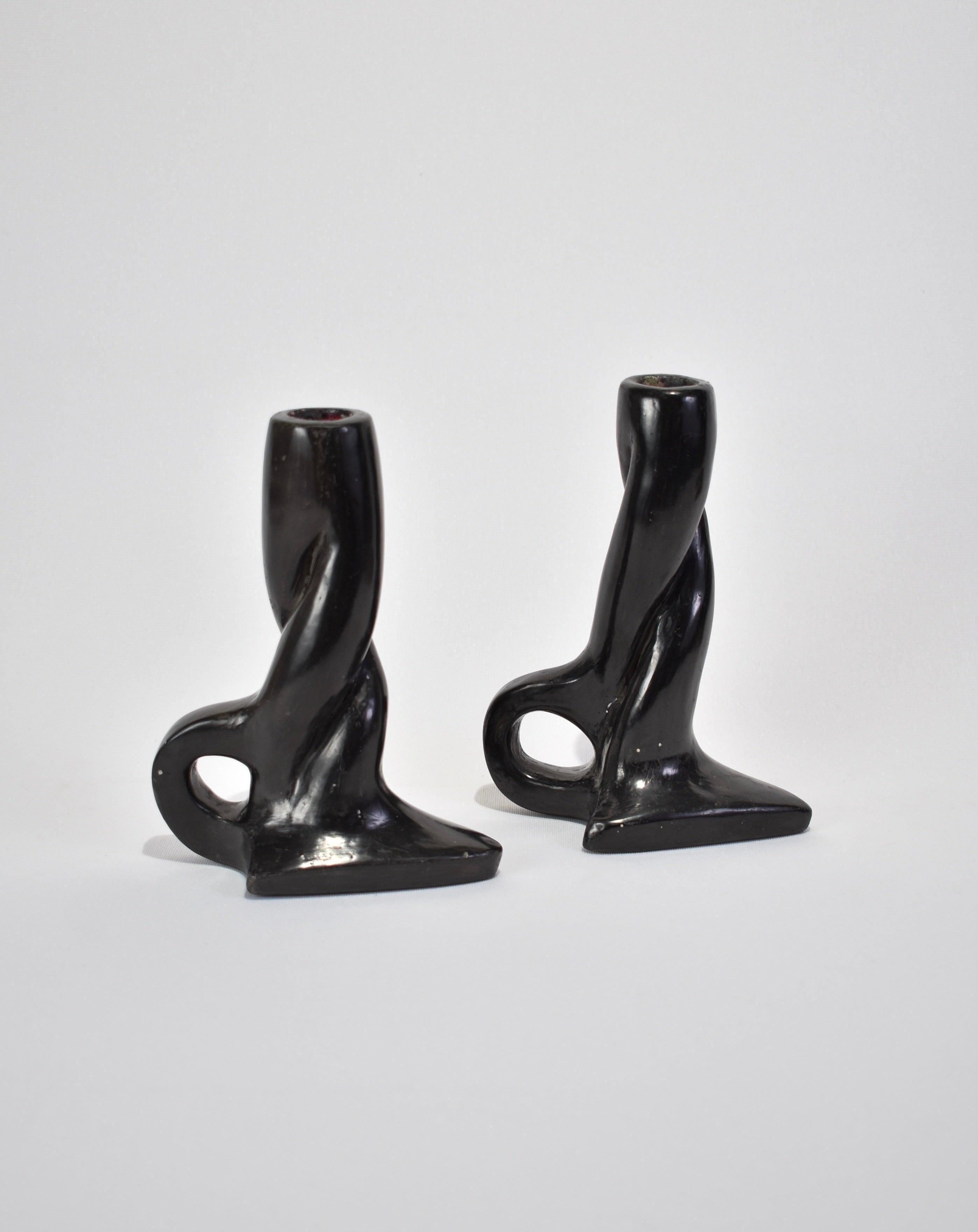 Stunning, handmade clay candleholder set of two in black with twisted detail and handles. Ca. early 1900s. 
 