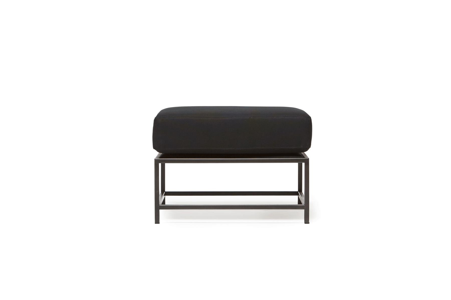 Designed to pair with any of the Inheritance Seating options, the Ottoman is a great addition to add a lounge element to your seating arrangement. 

This variation is upholstered in rich black canvas. The foam seat cushions have been wrapped in