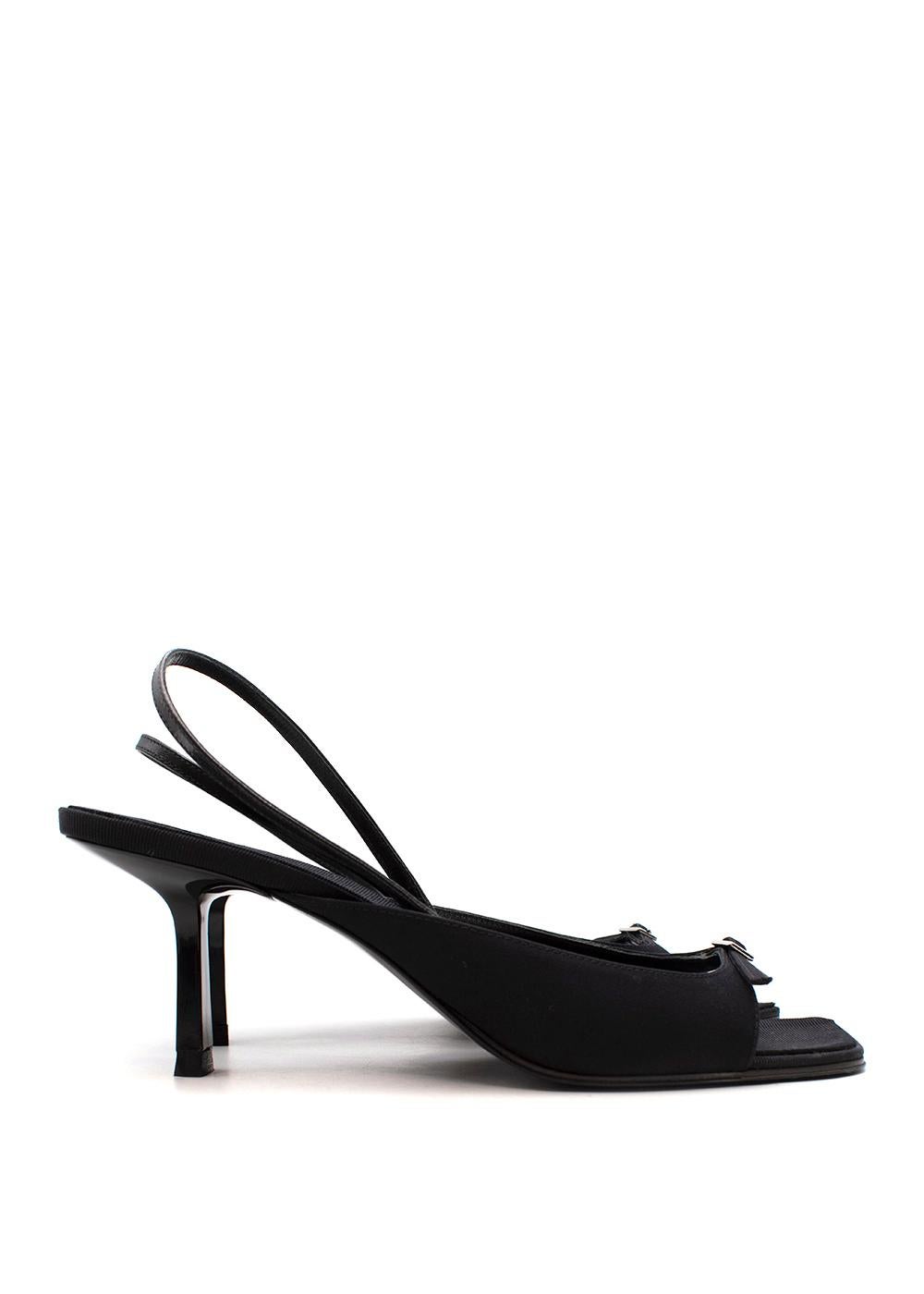 The Row Black Canvas & Leather Buckle-Front Slingback Heeled Sandals

- Minimal black canvas upper adorned with a small silver-tone metal buckle on the front of the foot
- Elasticated slingback strap 
- Set on a low stiletto heel
- Grosgrain lined