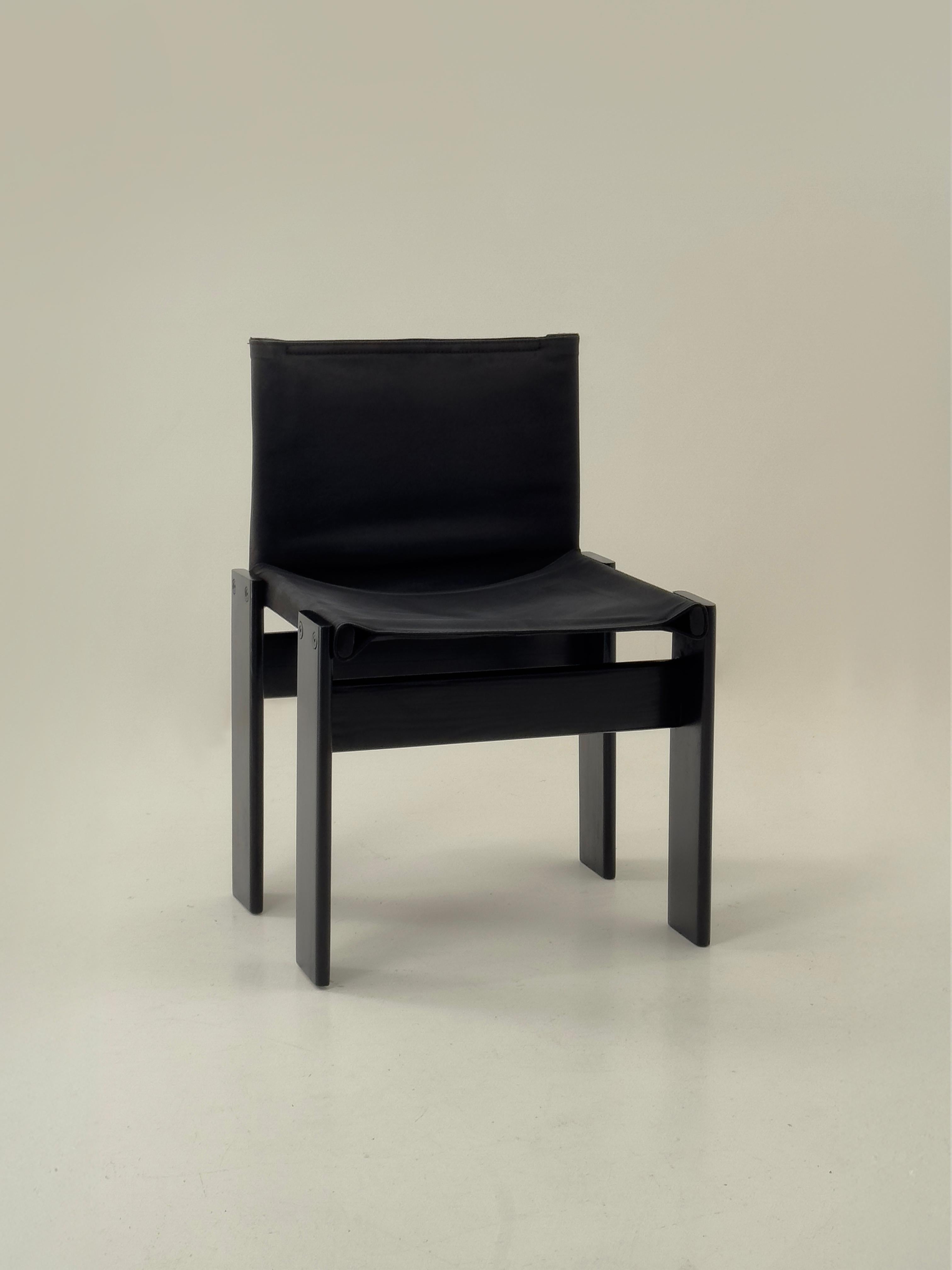 Black canvas Monk dining chairs designed by Afra & Tobia Scarpa for Molteni, Italy 1974.

In designing the Monk chairs, Afra and Tobia Scarpa emphasize the expressive potential of the materials, meticulously refining shapes and finishes to enhance
