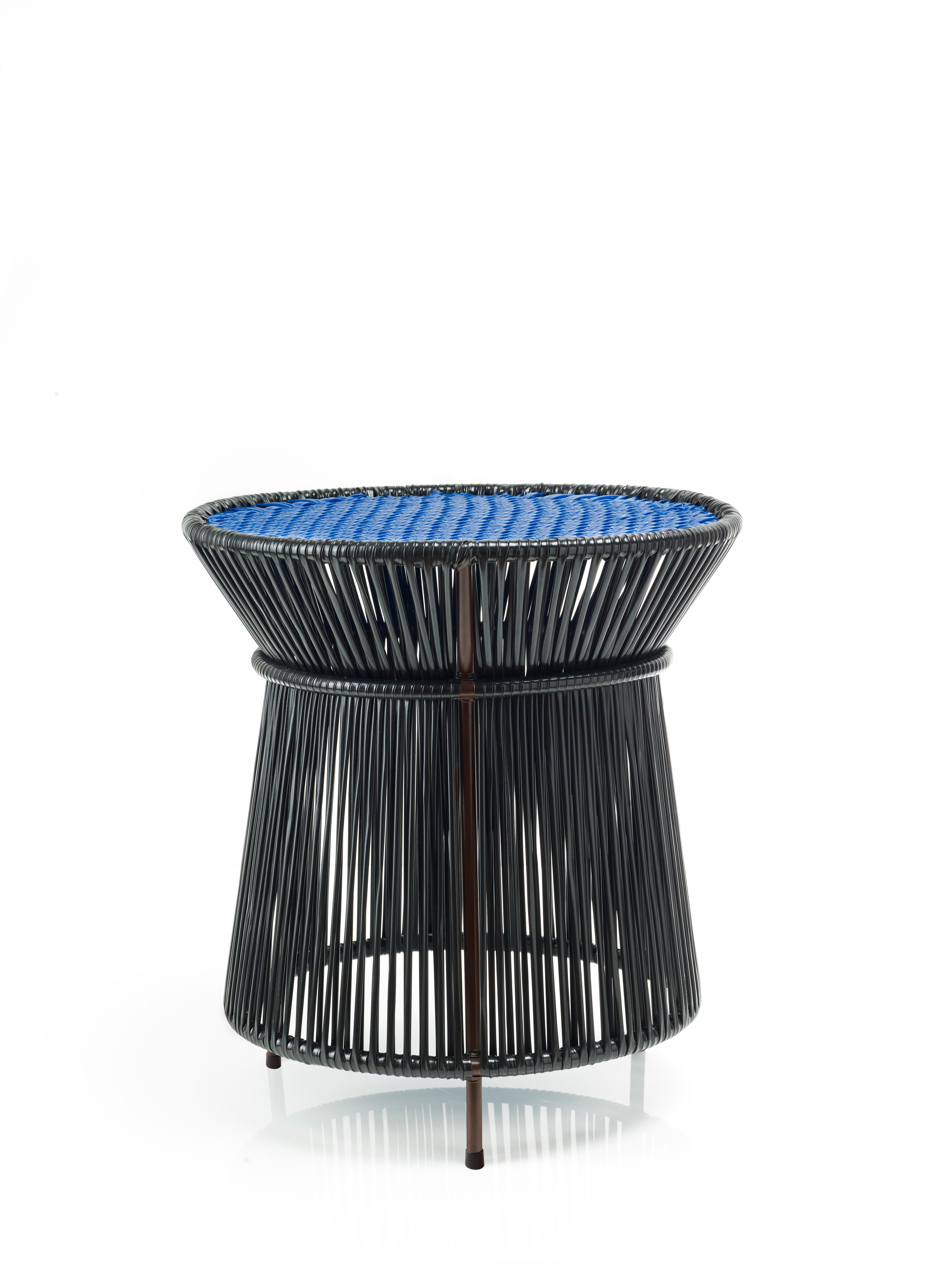 Black Caribe High table by Sebastian Herkner
Materials: Galvanized and powder-coated tubular steel. PVC strings are made from recycled plastic.
Technique: Made from recycled plastic and weaved by local craftspeople in Colombia. 
Dimensions: Diameter