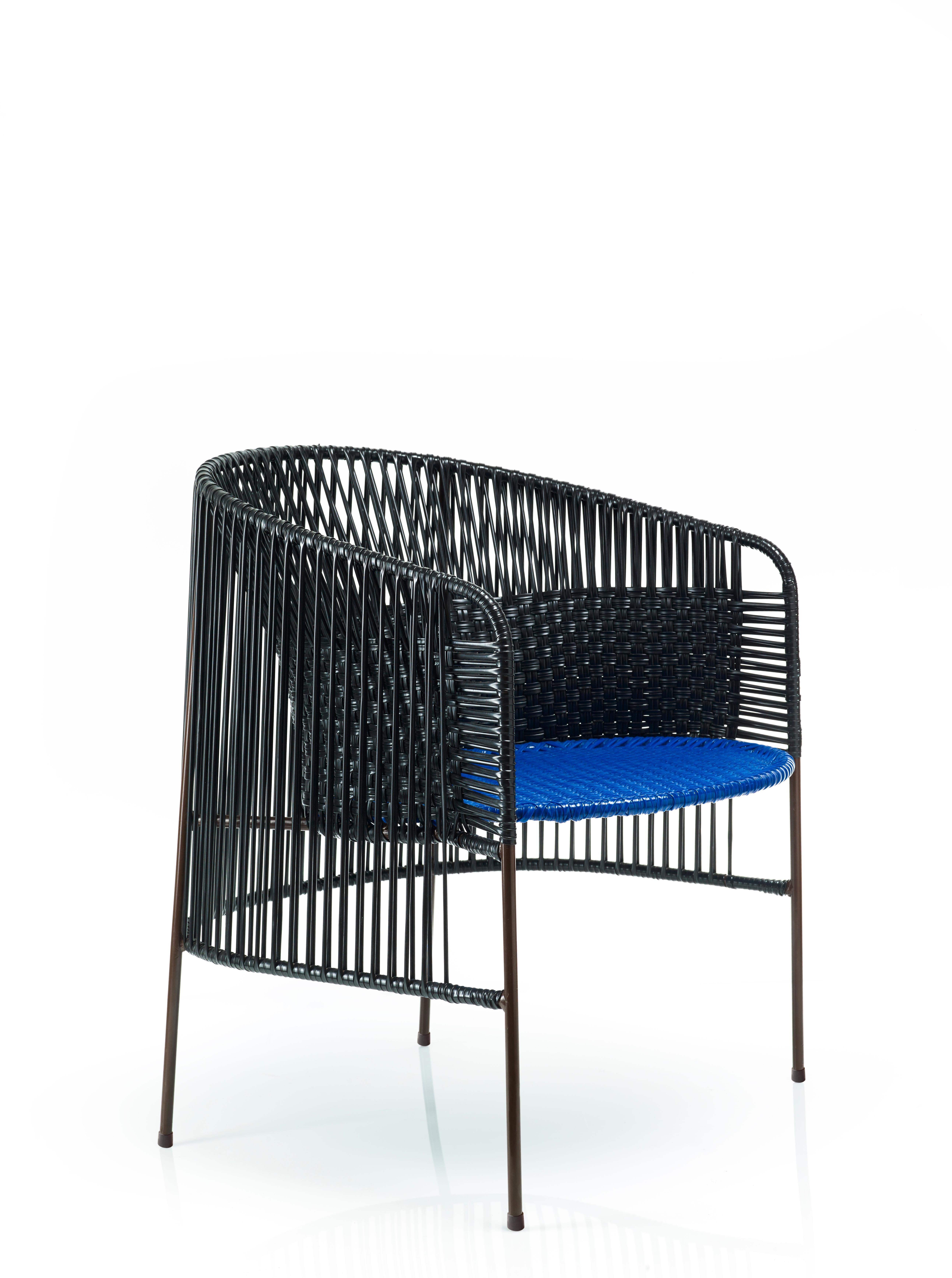 Black Caribe lounge chair by Sebastian Herkner
Materials: Galvanized and powder-coated tubular steel. PVC strings are made from recycled plastic.
Technique: Made from recycled plastic and weaved by local craftspeople in Colombia. 
Dimensions: W