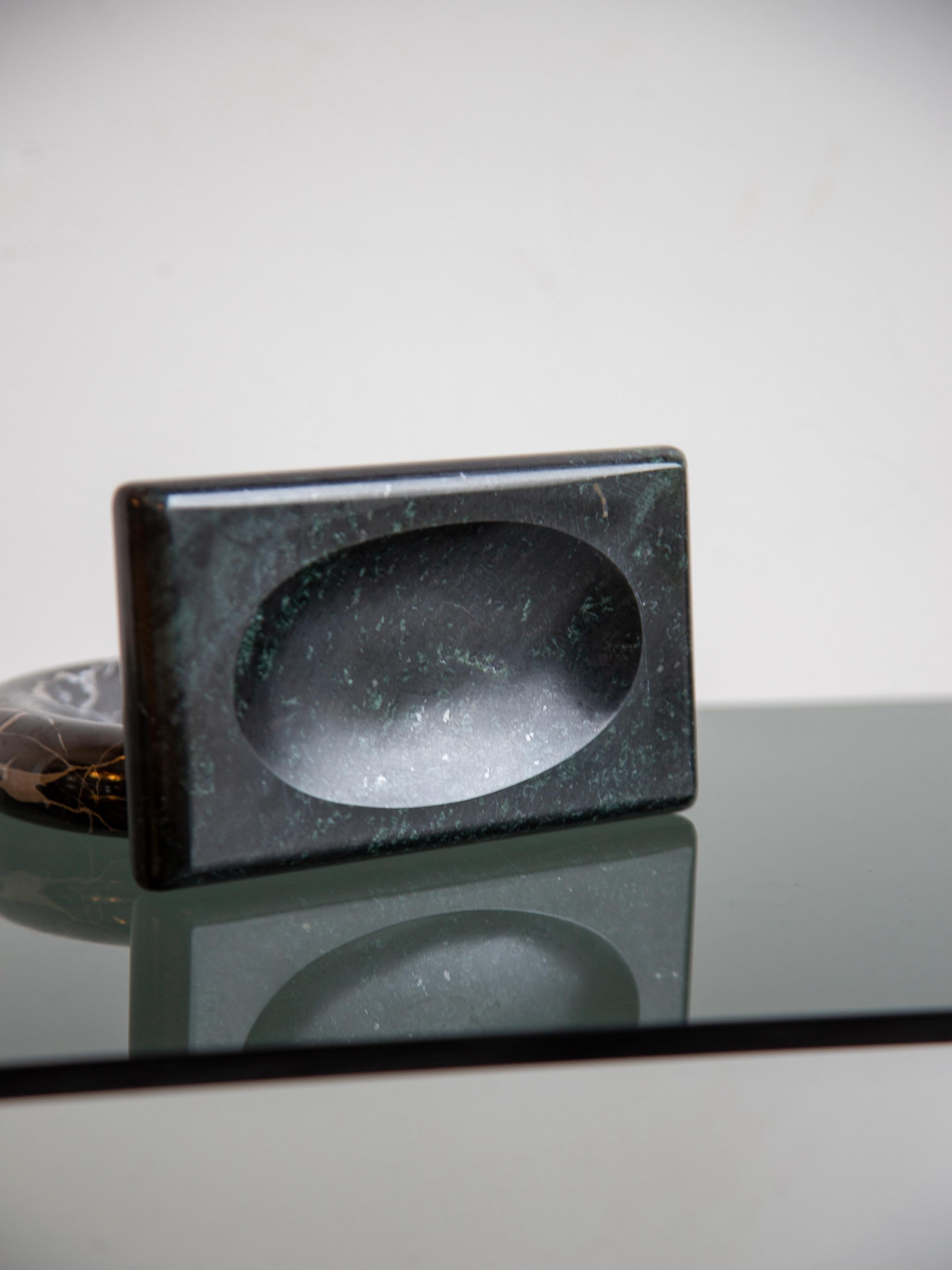 A sculptural Italian marble soap tray from the 1970s, elegantly carved with a minimalist sensibility. The rectangular form is softened by gently rounded corners and a shallow concave center, perfectly designed to cradle a bar of soap. Crafted from