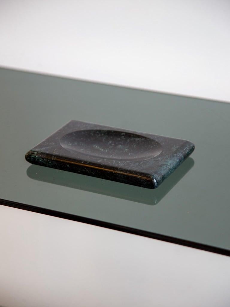 A sculptural Italian marble soap tray from the 1970s, elegantly carved with a minimalist sensibility. The rectangular form is softened by gently rounded corners and a shallow concave center, perfectly designed to cradle a bar of soap. Crafted from
