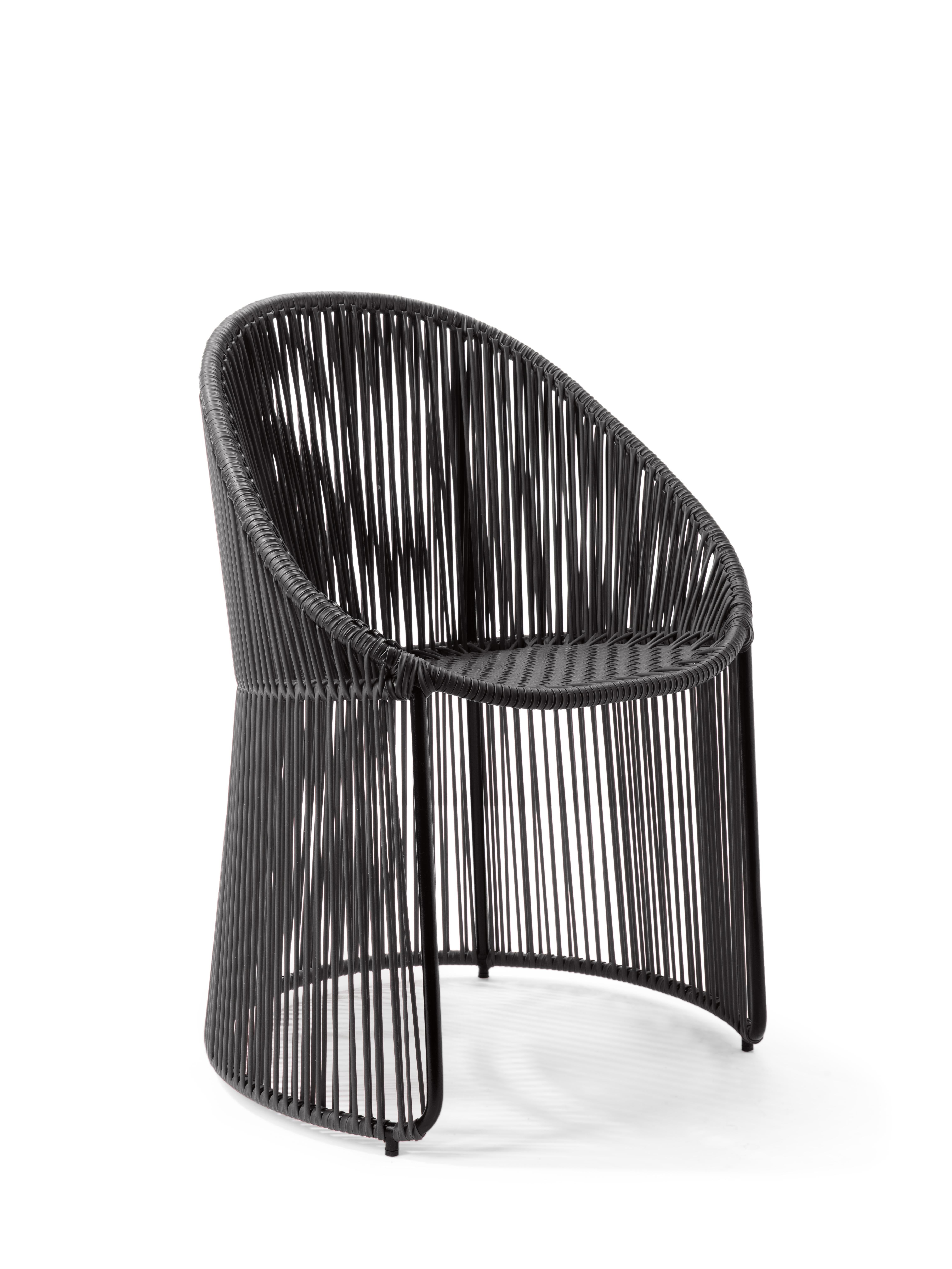 Black cartagenas dining chair by Sebastian Herkner
Materials: PVC strings. Galvanized and powder-coated tubular steel frame
Technique: made from recycled plastic. Weaved by local craftspeople in Colombia. 
Dimensions: W 60.2 x D 53.8 x H 84 cm