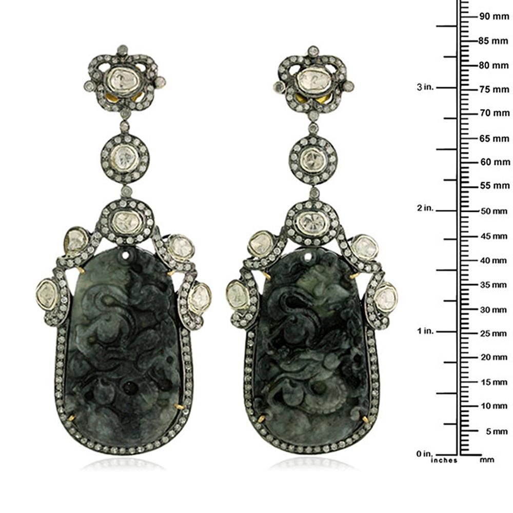 This long and lovely Black dragon carved Jade Earring is a traditional yet modern looking and will be great with any color outfit. This earring has small pave diamonds and rosecut diamond and is set in silver and gold.

Closure: Push Post

18K: