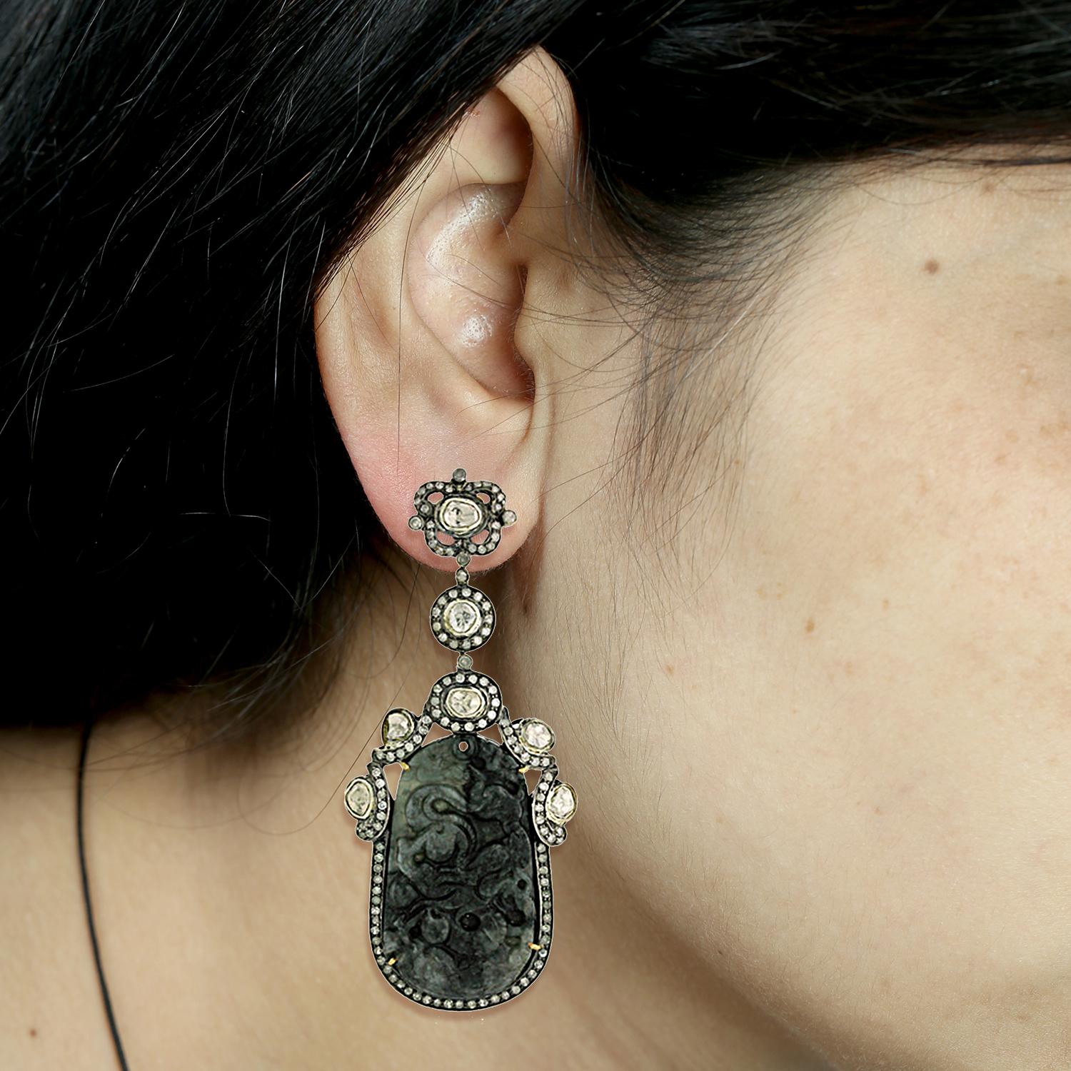 This long and lovely Black dragon carved Jade Earring is a traditional yet modern looking and will be great with any color outfit. This earring has small pave diamonds and rosecut diamond and is set in silver and gold.

Closure: Push Post

18K: