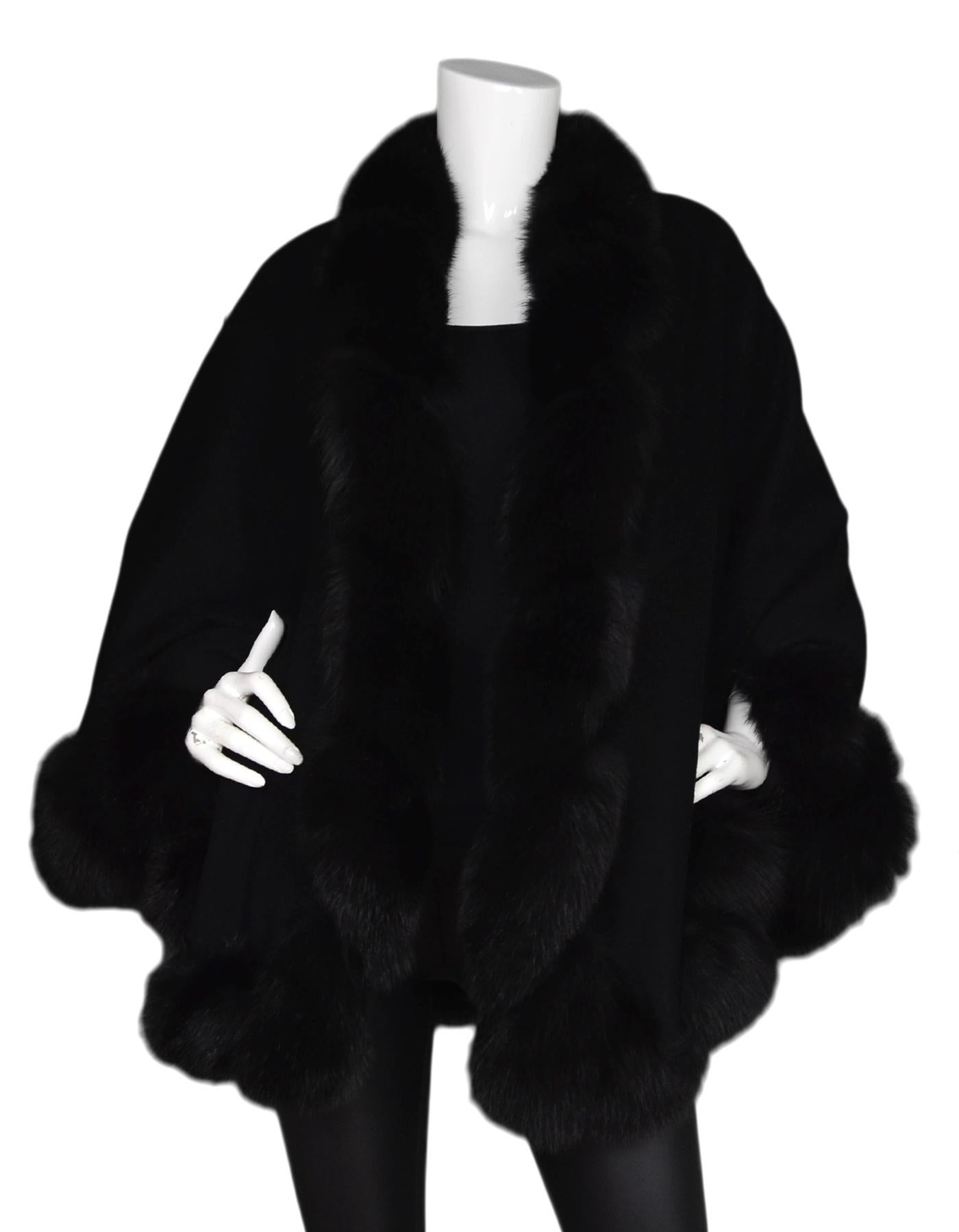 Black Cashmere Cape W/ Mink Trim 

Made In:  England
Color: Black
Materials: 100% cashmere, mink trim
Opening/Closure: Open front
Overall Condition: Excellent pre-owned condition 

Measurements: 
Across Center: 74
