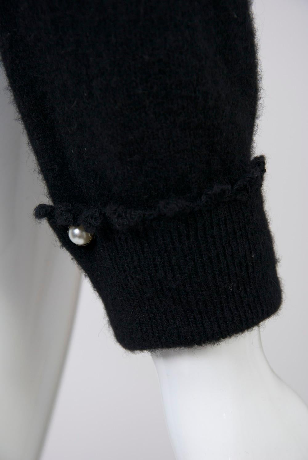 black cardigan with white collar