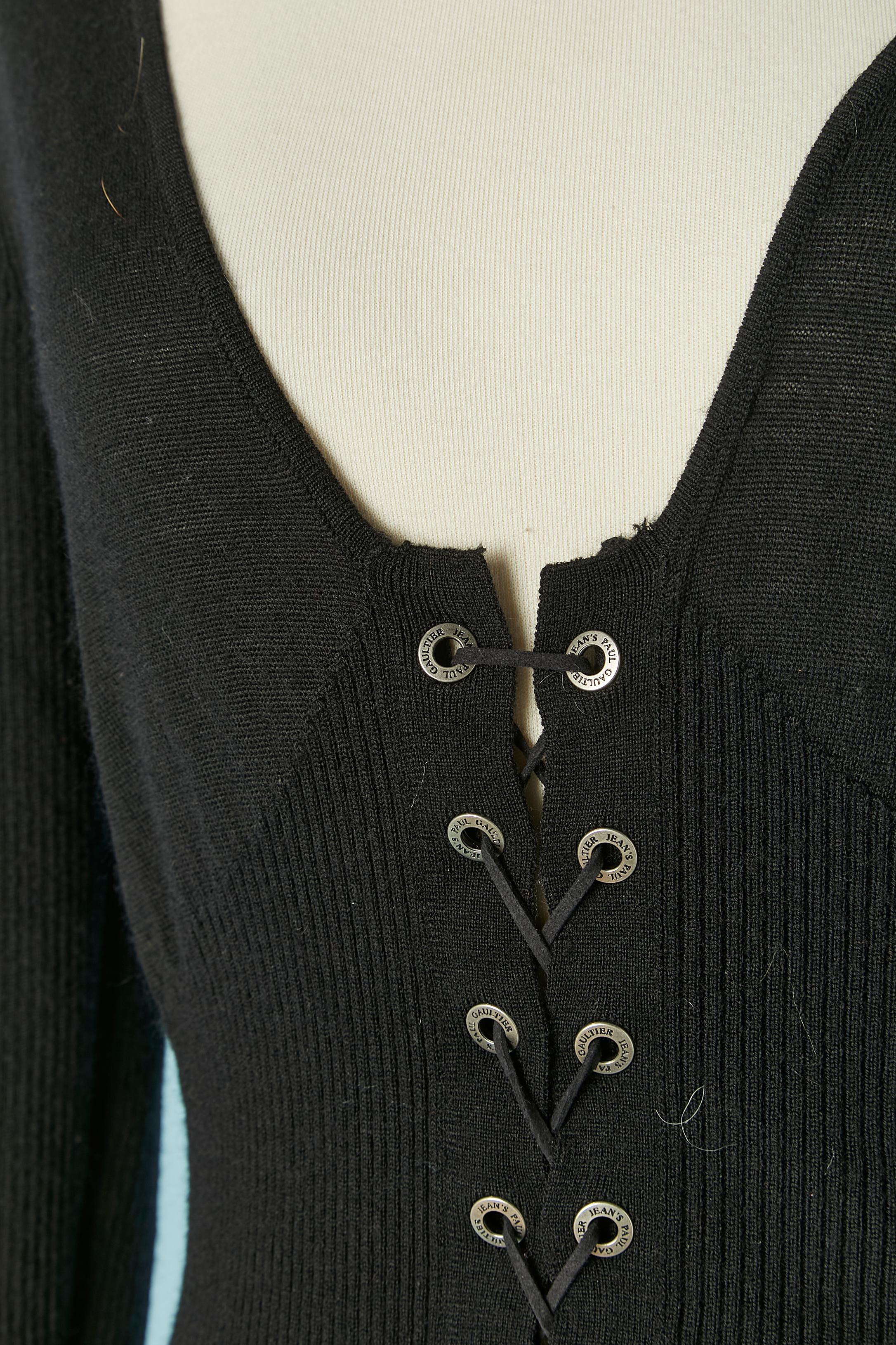 Black cashmere knit cardigan with suede laces closure and branded eyelet on the middle front. 
Size S 