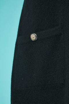 Black cashmere knit dress with short sleeves and clover brooches Chanel