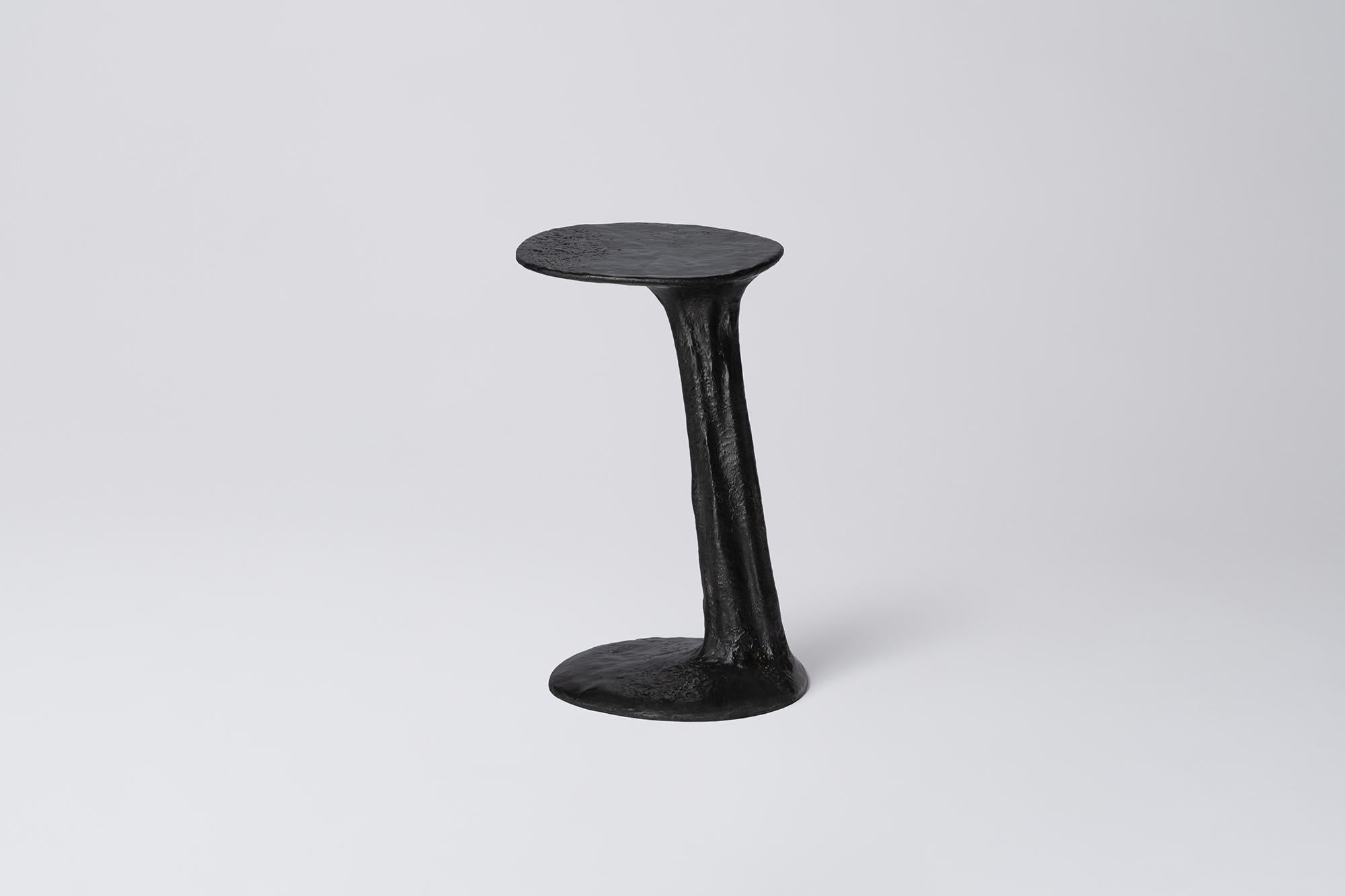 Black Cast Brass Lava Small Side Table by Atelier V&F
Dimensions: D 35 x W 30 x H 53 cm. 
Materials: Cast brass with a black finish.

Available in different finishes (cast, black and silver). Available in two different sizes. Prices may vary. Please