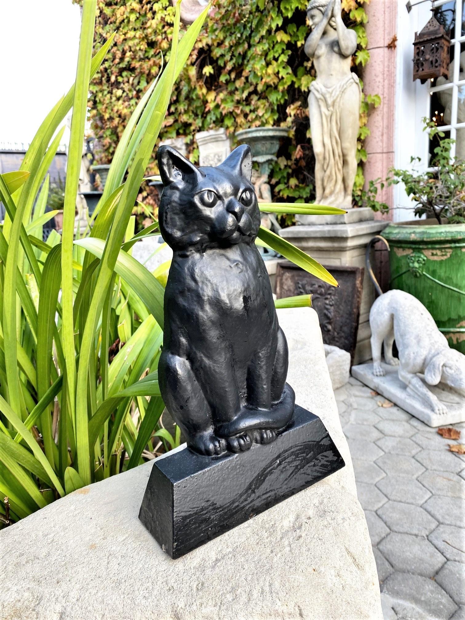 Black cat of cast iron hand painted door stop decorative gift for holiday season
Beautiful cast Iron of late 19th century Early 20th C. black cat of hand painted door stop decorative gift idea. Iron doorstop modelled as a sitting upright cat