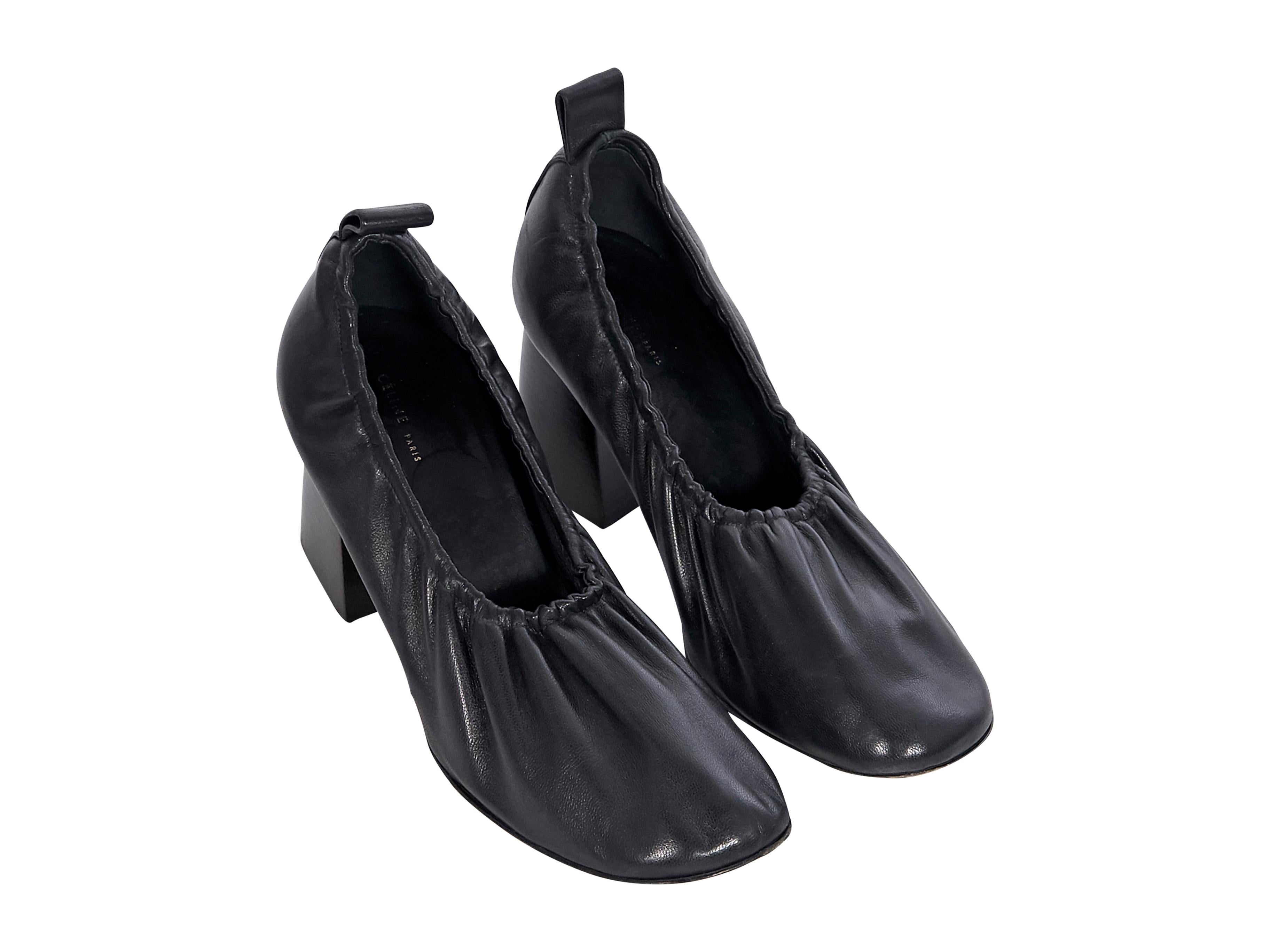 Product details:  Black leather ballerina-style pumps by Celine. Square-toe.  Stacked heel. Slip-on style. Style yours with a patterned pencil skirt. Label size FR 39. 3