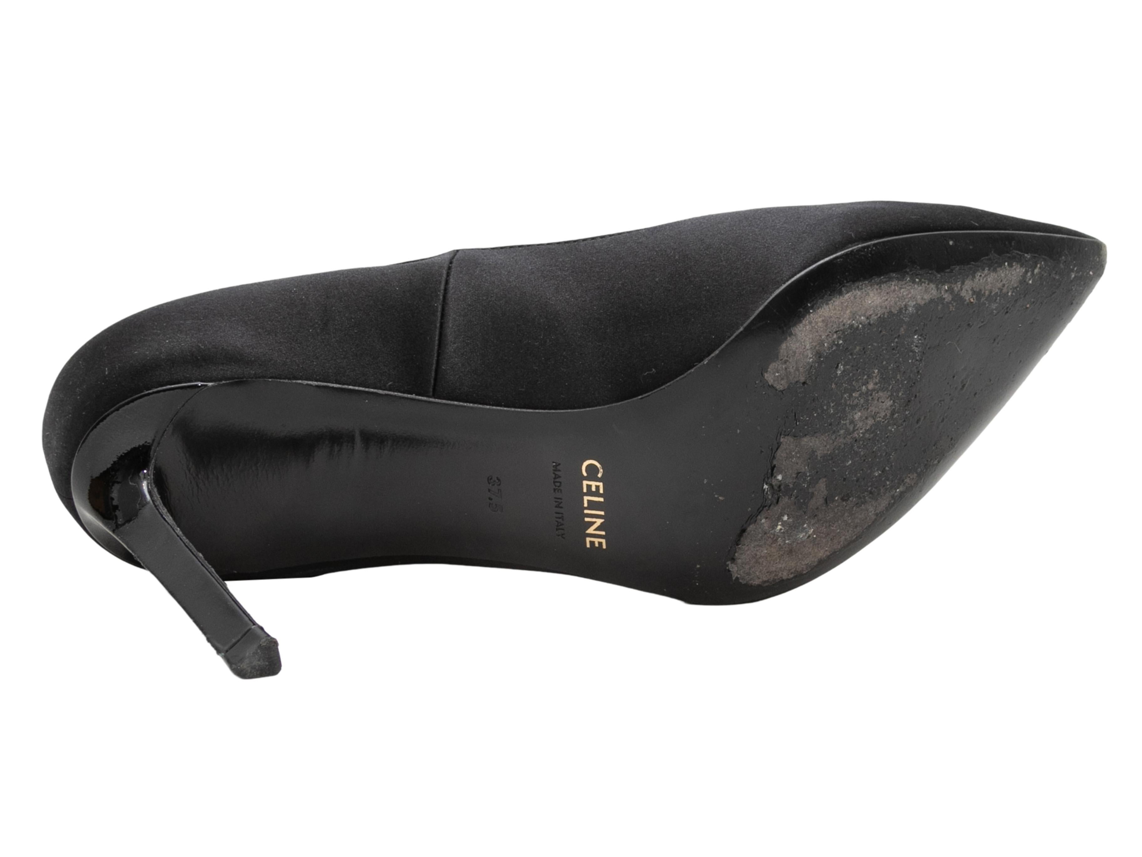 Black satin and patent leather pointed-toe Mary Jane pumps by Celine. 3.25