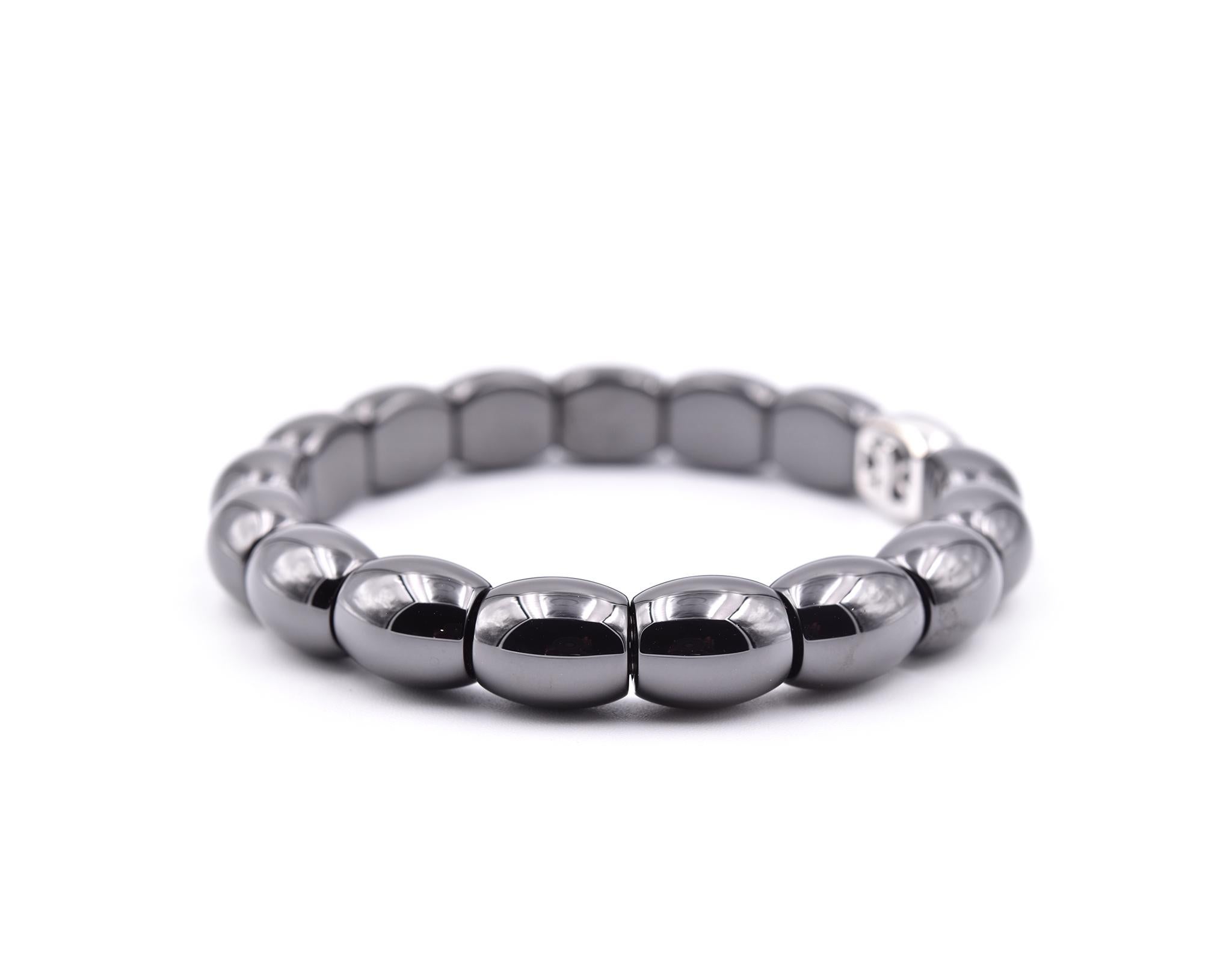 Designer: custom designed 
Material: Black Ceramic and 18k White Gold 
Dimensions; Bracelet will fit a 6.5 inch wrist and it is 6.65mm wide 
Weight: 43.88