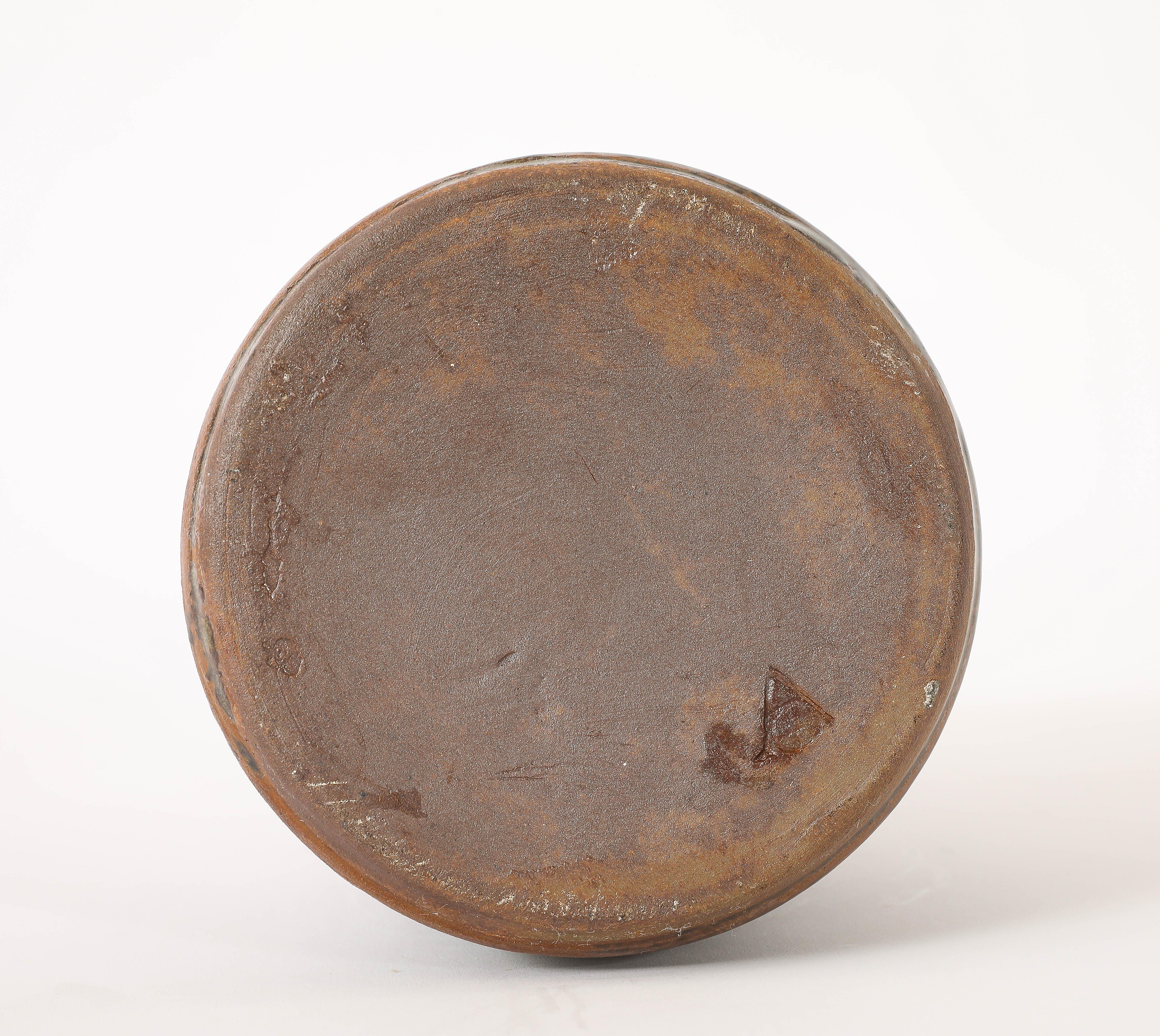 Large ceramic lamp in the manner of Jouve on a brass base.
