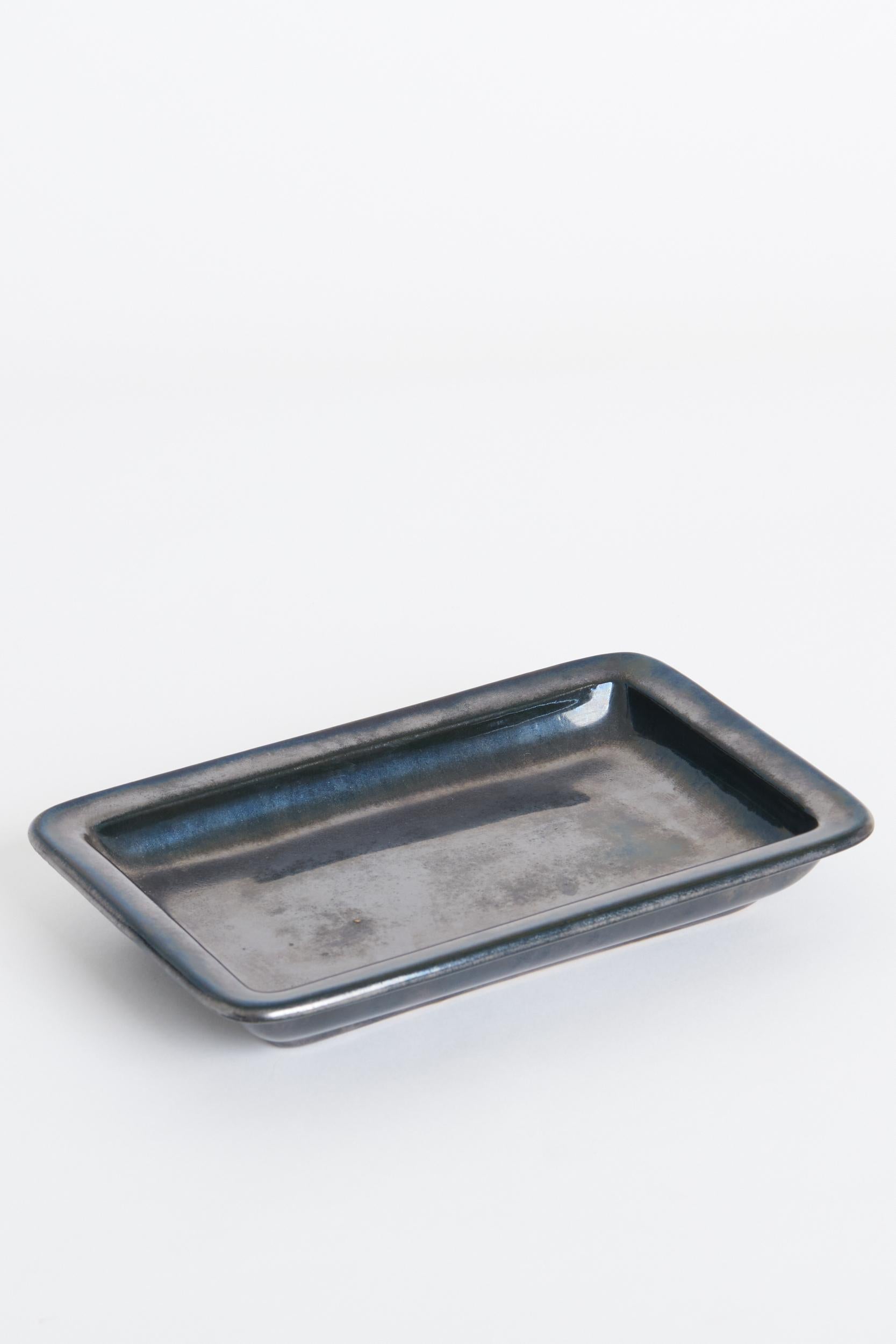 A black ceramic rectangular vide poche by Alice Sordet-Bonifas - aka Lifas (1902-1975).
Signed. 
France or Switzerland, Mid-20th Century
3 cm high by 21 cm wide by 14 cm depth.