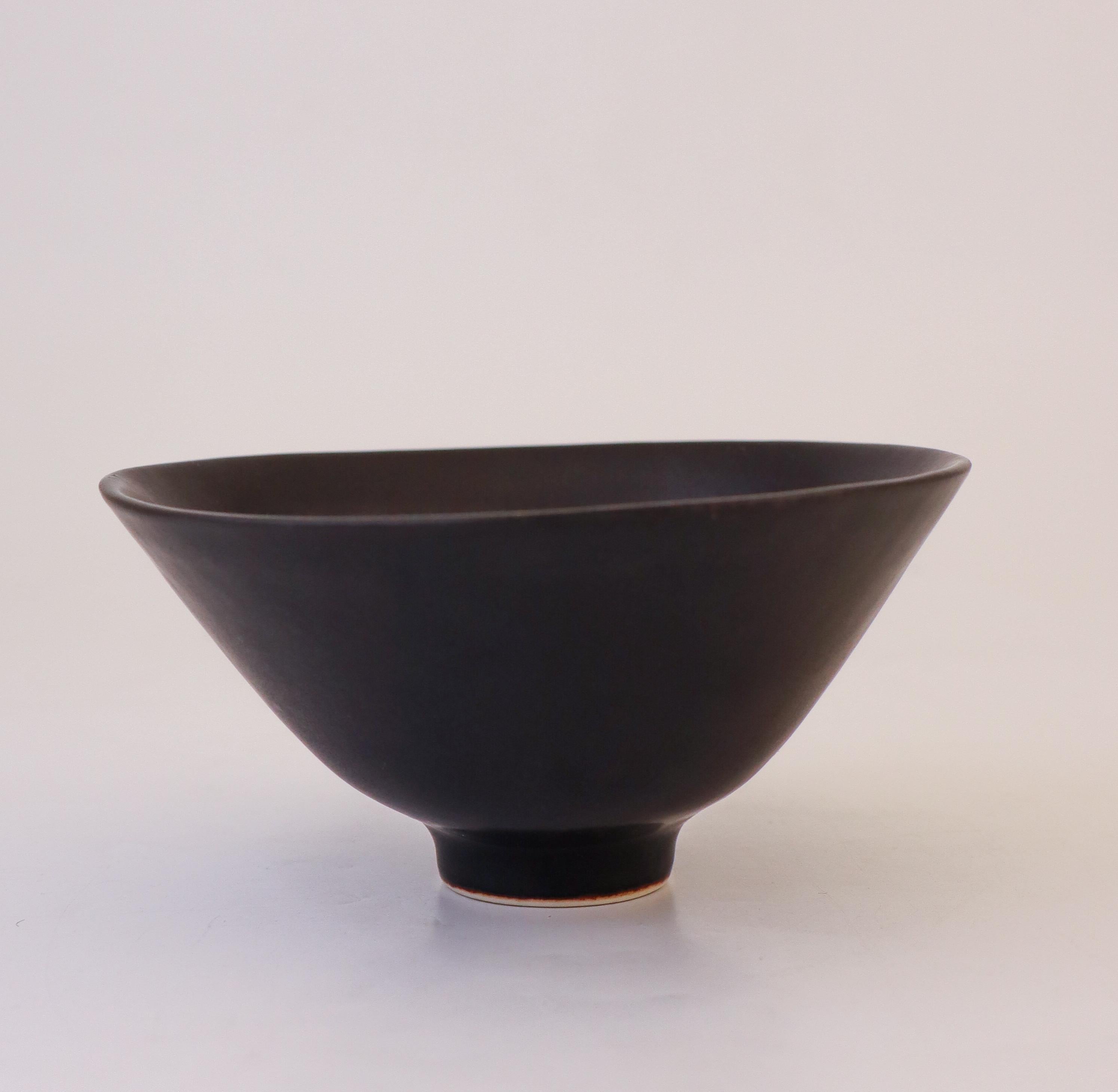 A lovely black mid-century bowl in ceramic from Rörstrand, Sweden, designed by Carl-Harry Stålhane. The bowl is marked as 1st quality and it is in excellent condition. 

Carl-Harry Stålhane is one of the top names when it comes to Mid century