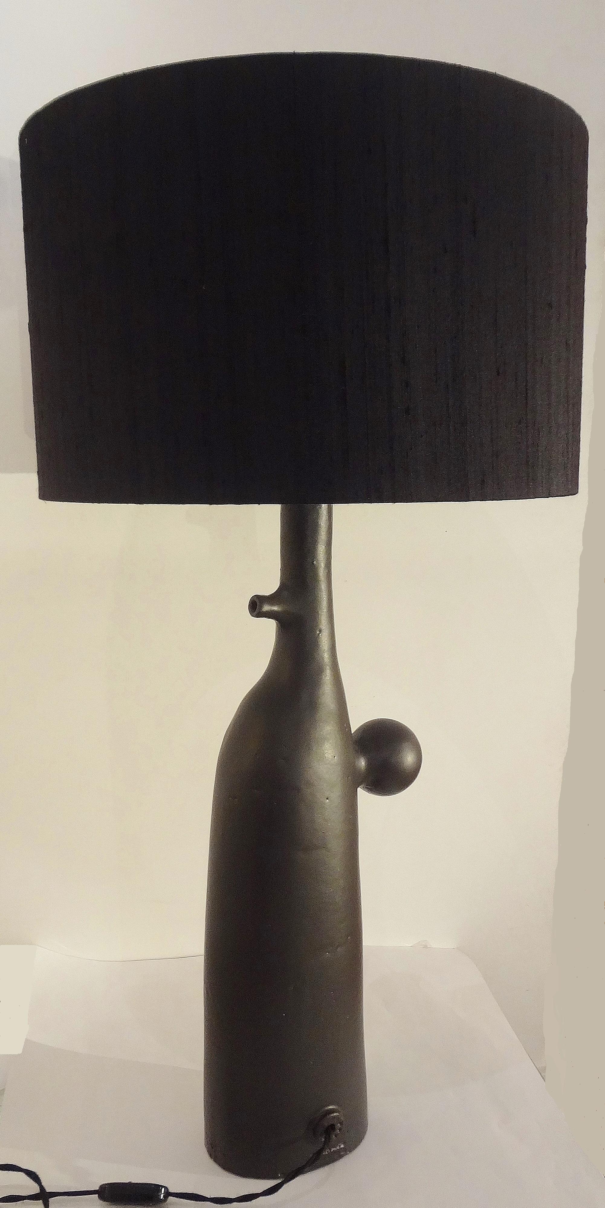 Wouter Hoste, Belgium.
Original black mate enameled ceramic lamp called “Moonraker 3”, 2015.
One-of-a-kind piece. Signed. Black fabric shade.
Base H 54 x D 19 cm.

 
