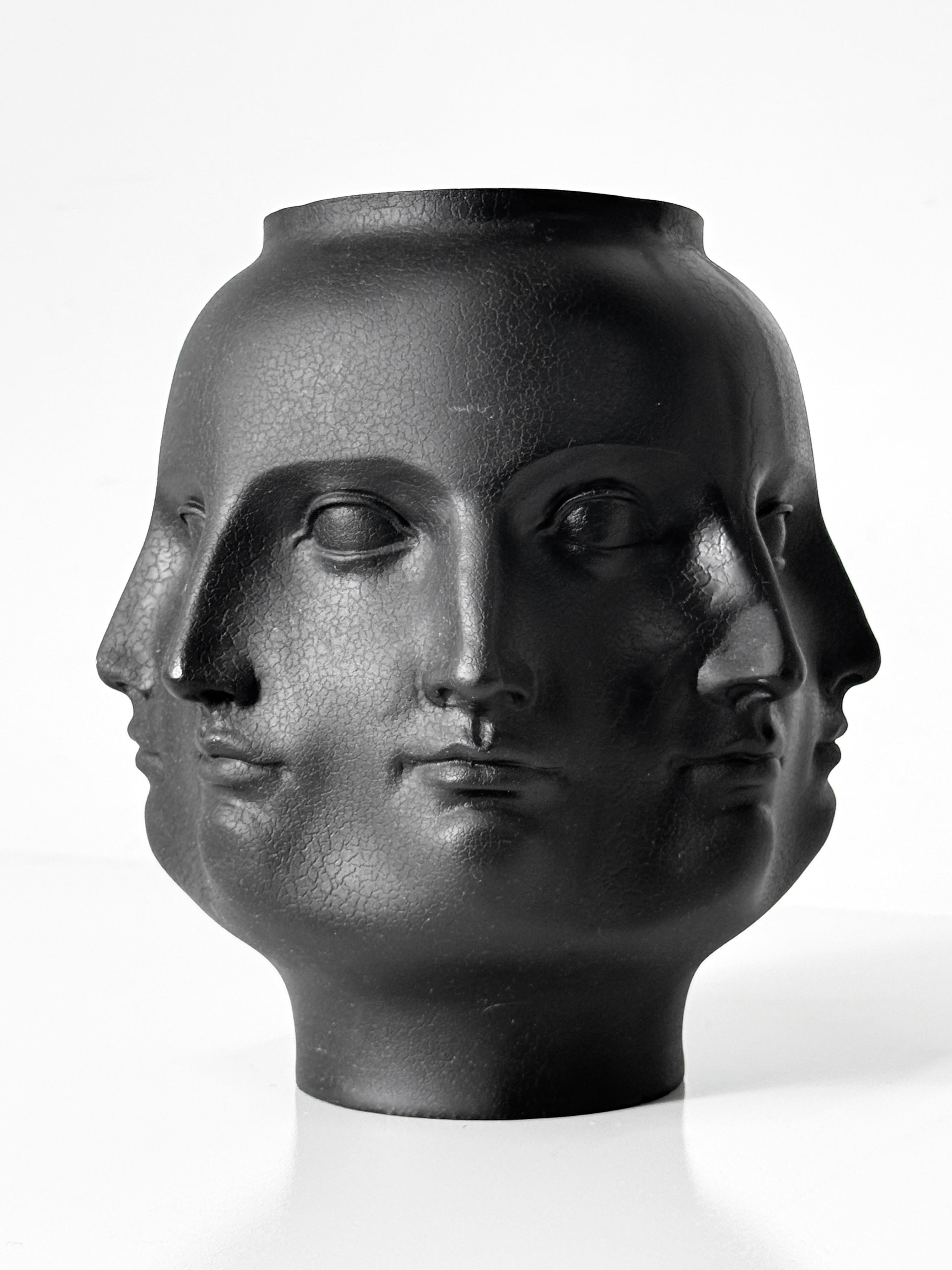 Multi face ceramic vase in black by TMS Inc
Vitruvian Collection 2005

Perpetual face design in the style of Piero Fornasetti
Signed and dated to lower edge

8 inch diameter 
9.5 inch height

Complimenting white vase shown is available and listed