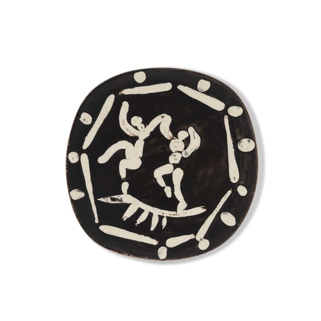 White earthenware ceramic plate with black engobe and white glaze.
Stamped 'Madoura Plein Feu/Empreinte Originale de Picasso' (underneath).
(A.R. 380)